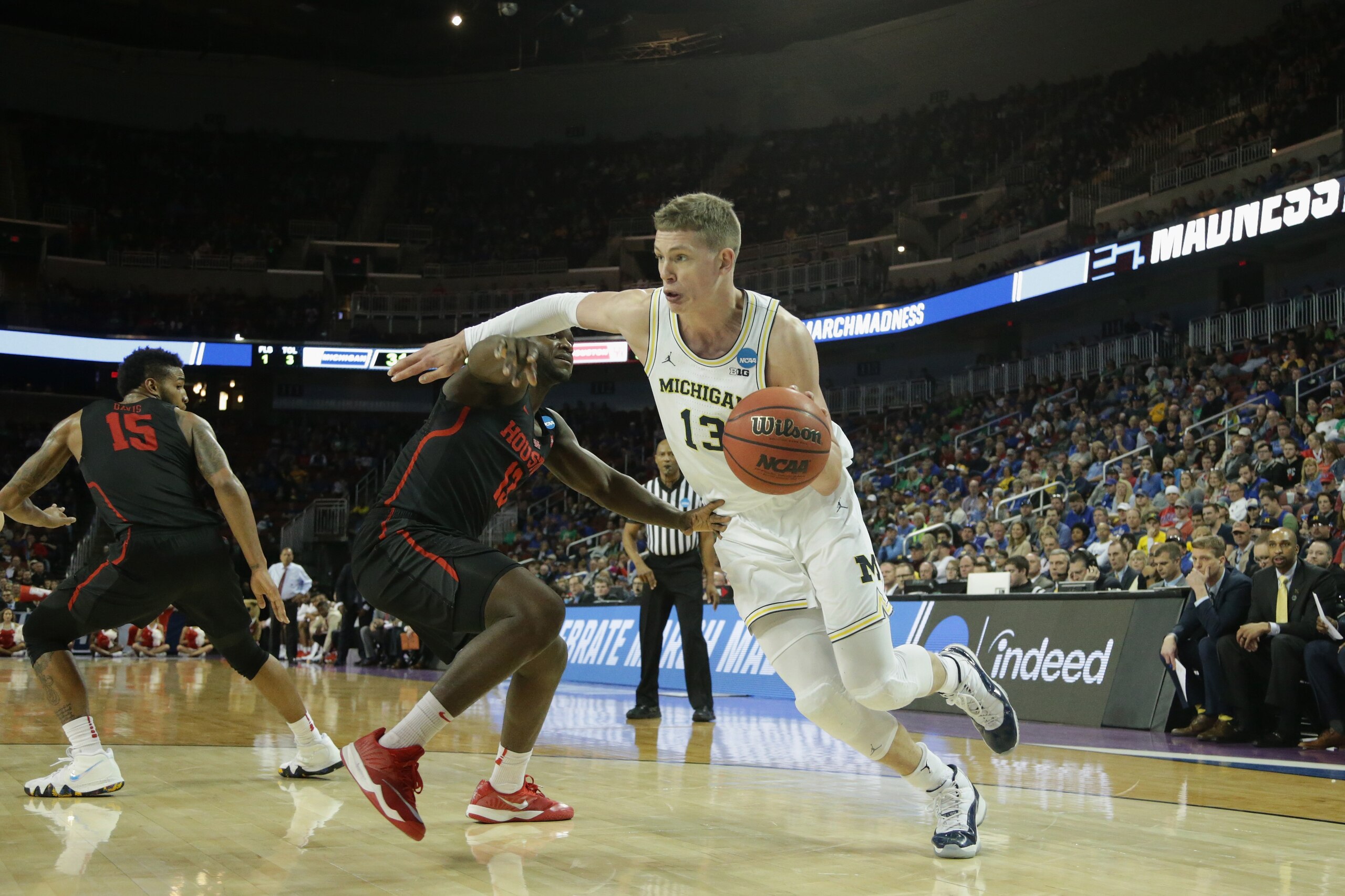 WICHITA, KS - MARCH 17: Moritz Wagner #13 of the Michigan Wolverines drives against Wes VanBeck #12 of the Houston Cougars in the second half during the second round of the 2018 NCAA Men's Basketball Tournament at INTRUST Bank Arena on March 17, 2018 in W