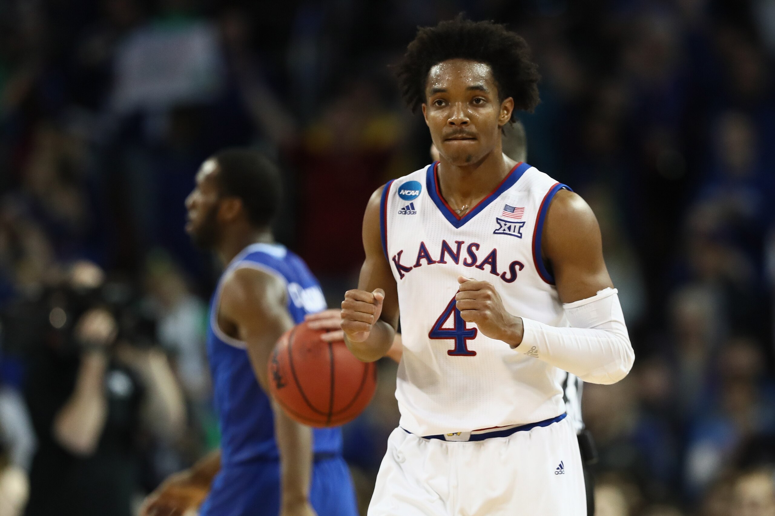 WICHITA, KS - MARCH 17:  Devonte' Graham #4 of the Kansas Jayhawks reacts against the Seton Hall Pirates in the second half during the second round of the 2018 NCAA Men's Basketball Tournament at INTRUST Bank Arena on March 17, 2018 in Wichita, Kansas.  (