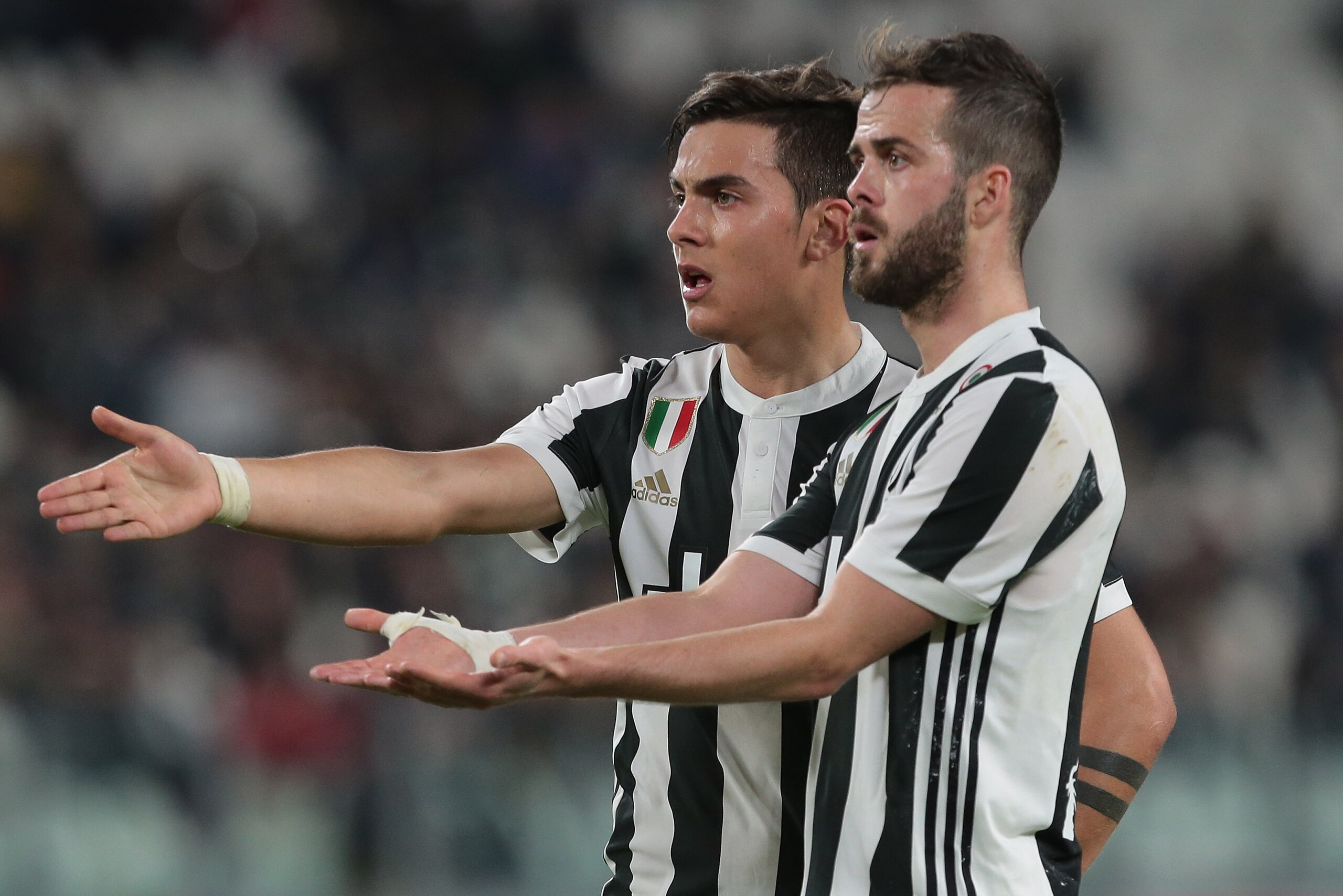 TURIN, ITALY - MARCH 14:  Paulo Dybala (L) and Miralem Pjanic of Juventus FC gesture during the serie A match between Juventus and Atalanta BC at Allianz Stadium on March 14, 2018 in Turin, Italy.  (Photo by Emilio Andreoli/Getty Images)