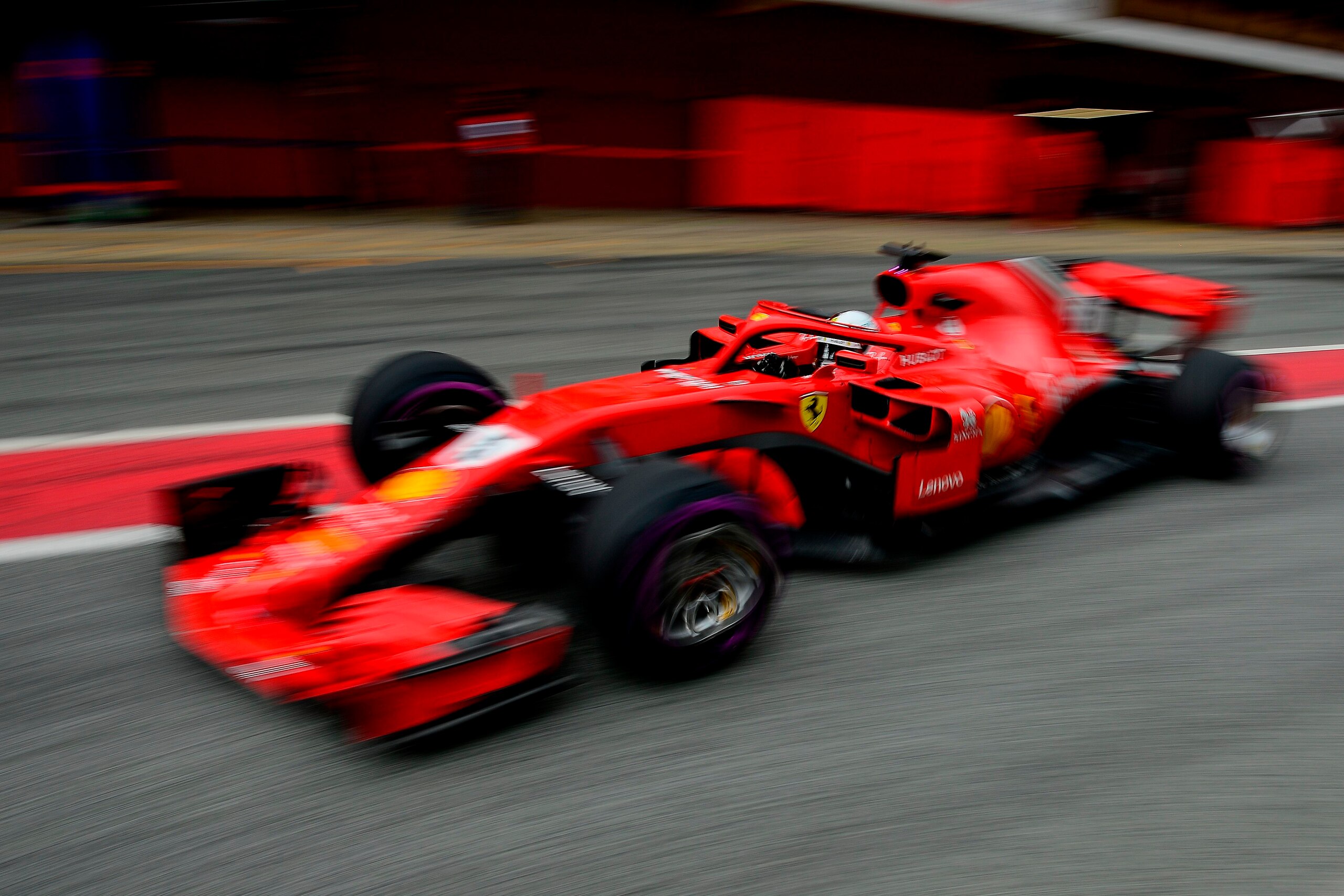 Ferrari's German driver Sebastian Vettel leaves the pits at the Circuit de Catalunya on March 8, 2018 in Montmelo on the outskirts of Barcelona during the third day of the second week of tests for the Formula One Grand Prix season. / AFP PHOTO / Josep LAG Ferrari's German driver Sebastian Vettel leaves the pits at the Circuit de Catalunya on March 8, 2018 in Montmelo on the outskirts of Barcelona during the third day of the second week of tests for the Formula One Grand Prix season. / AFP PHOTO / Josep LAG