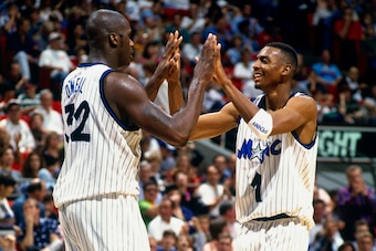 ORLANDO, FL - 1995: Anfernee Hardaway #1 and Shaquille O'Neal #32 of the Orlando Magic high five each other circa 1995 at the Orlando Arena in Orlando, Florida. NOTE TO USER: User expressly acknowledges and agrees that, by downloading and or using this ph