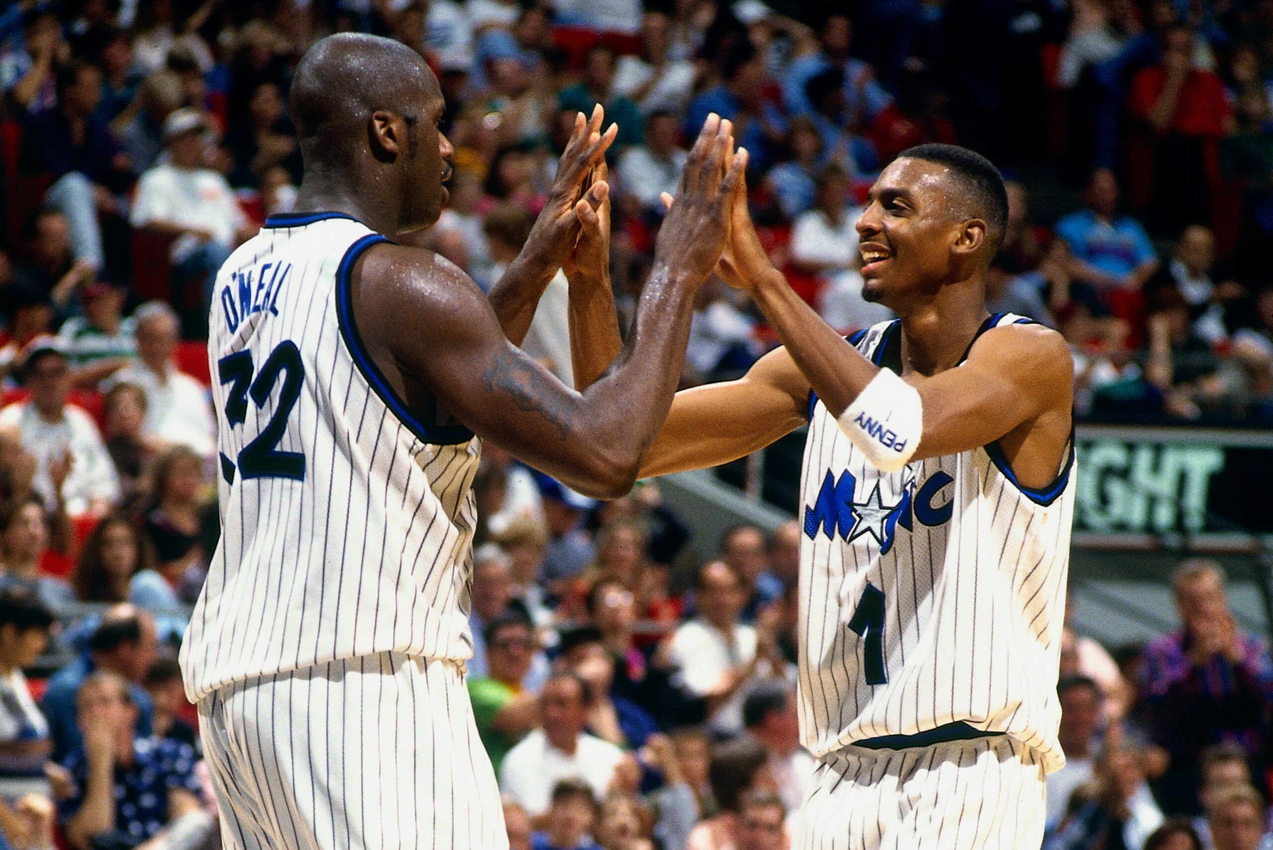 ORLANDO, FL - 1995: Anfernee Hardaway #1 and Shaquille O'Neal #32 of the Orlando Magic high five each other circa 1995 at the Orlando Arena in Orlando, Florida. NOTE TO USER: User expressly acknowledges and agrees that, by downloading and or using this ph ORLANDO, FL - 1995: Anfernee Hardaway #1 and Shaquille O'Neal #32 of the Orlando Magic high five each other circa 1995 at the Orlando Arena in Orlando, Florida. NOTE TO USER: User expressly acknowledges and agrees that, by downloading and or using this ph