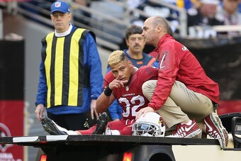 GLENDALE, AZ - DECEMBER 08:  Free safety Tyrann Mathieu #32 of the Arizona Cardinals is taken off the field on a cart after an injury during the third quarter of the NFL game against the St. Louis Rams at the University of Phoenix Stadium on December 8, 2