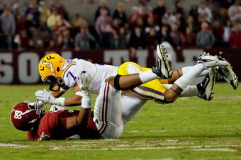 TUSCALOOSA, AL - NOVEMBER 05:  Tyrann Mathieu #7 of the LSU Tigers tackles Michael Williams #89 of the Alabama Crimson Tide during the game at Bryant-Denny Stadium on November 5, 2011 in Tuscaloosa, Alabama.  (Photo by Kevin C. Cox/Getty Images)