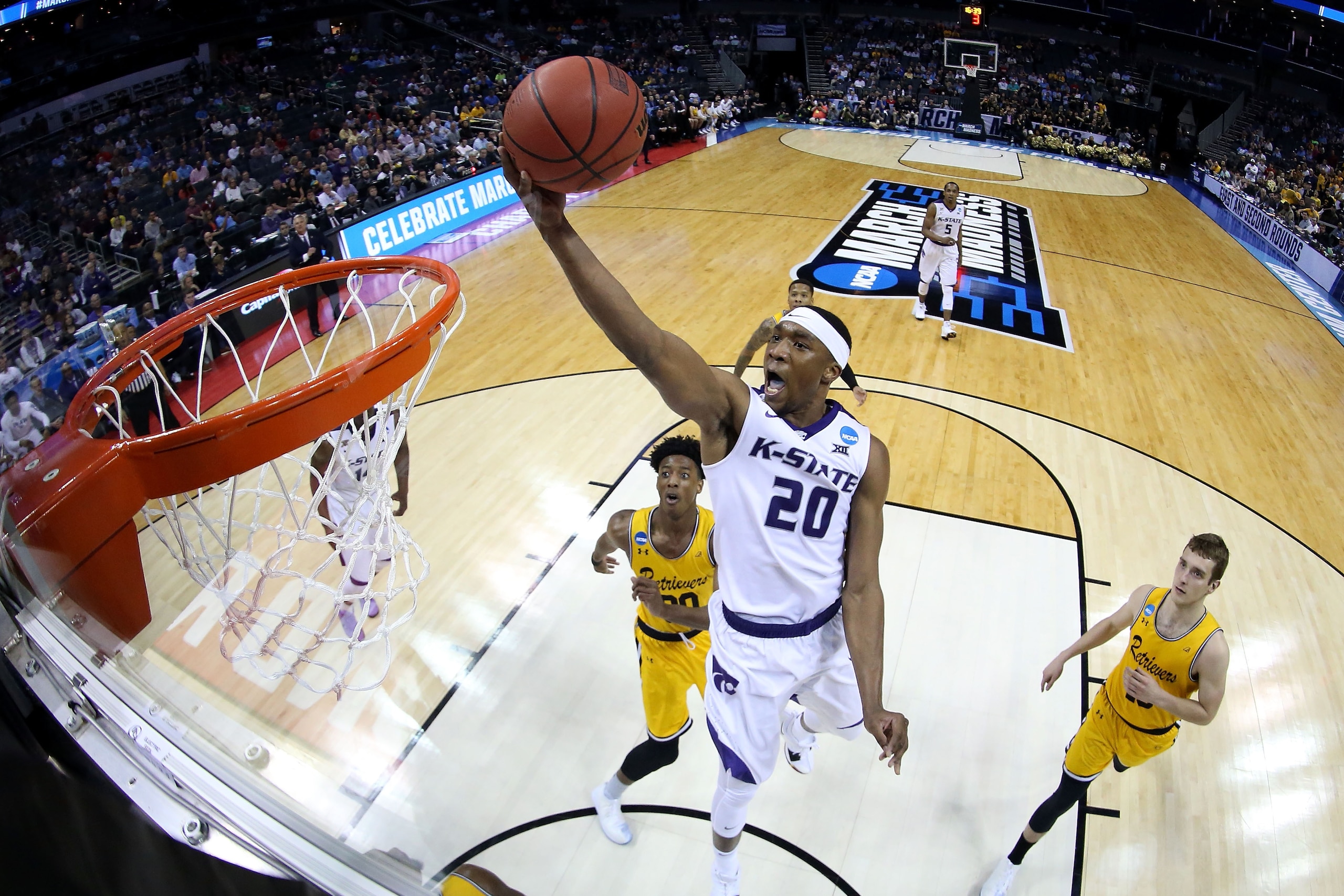 CHARLOTTE, NC - MARCH 18:  Xavier Sneed #20 of the Kansas State Wildcats dunks on the UMBC Retrievers during the second round of the 2018 NCAA Men's Basketball Tournament at Spectrum Center on March 18, 2018 in Charlotte, North Carolina.  (Photo by Jared 