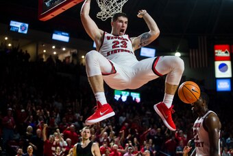 BOWLING GREEN, KY - JANUARY 27:  Forward Justin Johnson #23 of the Western Kentucky Hilltoppers dunks the ball in a game against Marshall University at E.A. Diddle Arena on January 27, 2018 in Bowling Green, Ky. (Photo by Shaban Athuman/ Getty Images)