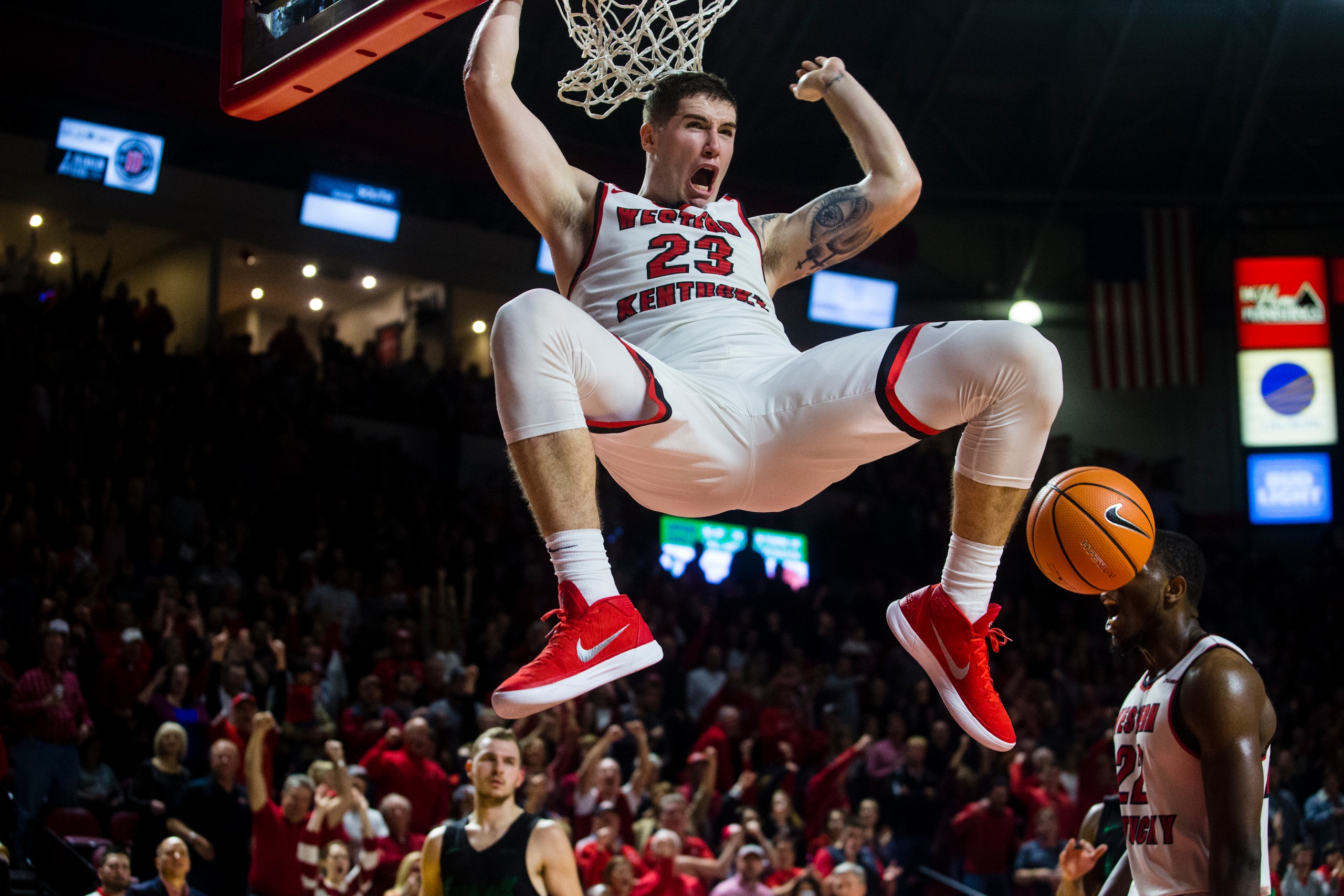 BOWLING GREEN, KY - JANUARY 27:  Forward Justin Johnson #23 of the Western Kentucky Hilltoppers dunks the ball in a game against Marshall University at E.A. Diddle Arena on January 27, 2018 in Bowling Green, Ky. (Photo by Shaban Athuman/ Getty Images)