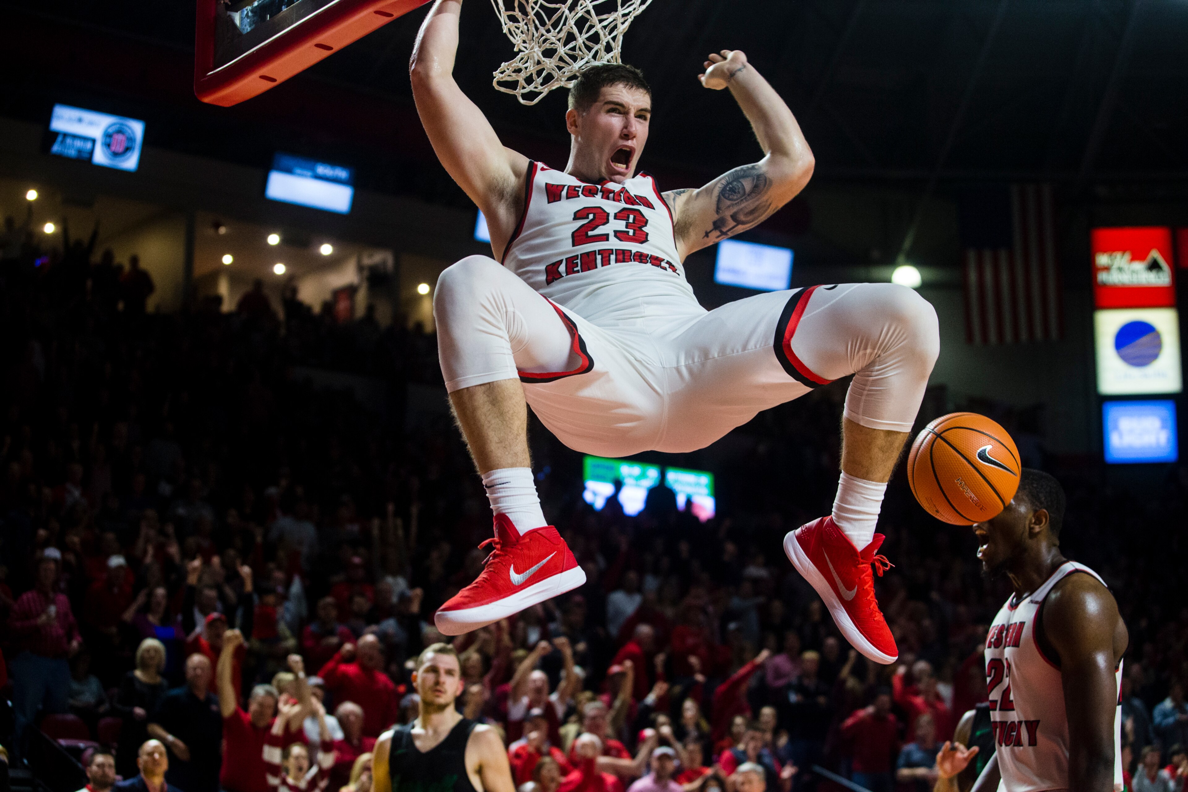 BOWLING GREEN, KY - JANUARY 27:  Forward Justin Johnson #23 of the Western Kentucky Hilltoppers dunks the ball in a game against Marshall University at E.A. Diddle Arena on January 27, 2018 in Bowling Green, Ky. (Photo by Shaban Athuman/ Getty Images)