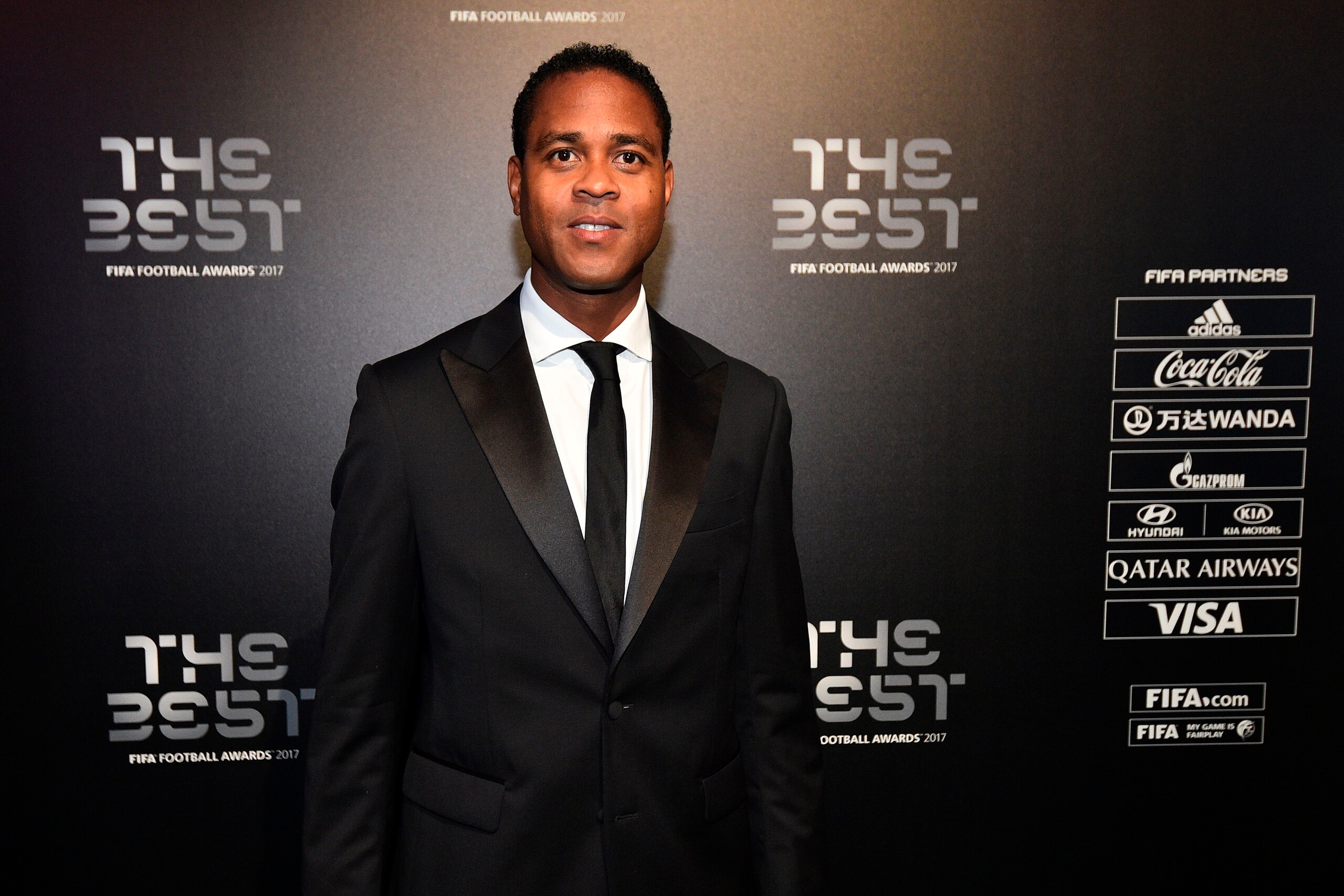 Netherland's former player Patrick Kluivert poses for a photograph as he arrives for The Best FIFA Football Awards ceremony, on October 23, 2017 in London. / AFP PHOTO / Glyn KIRK        (Photo credit should read GLYN KIRK/AFP/Getty Images)