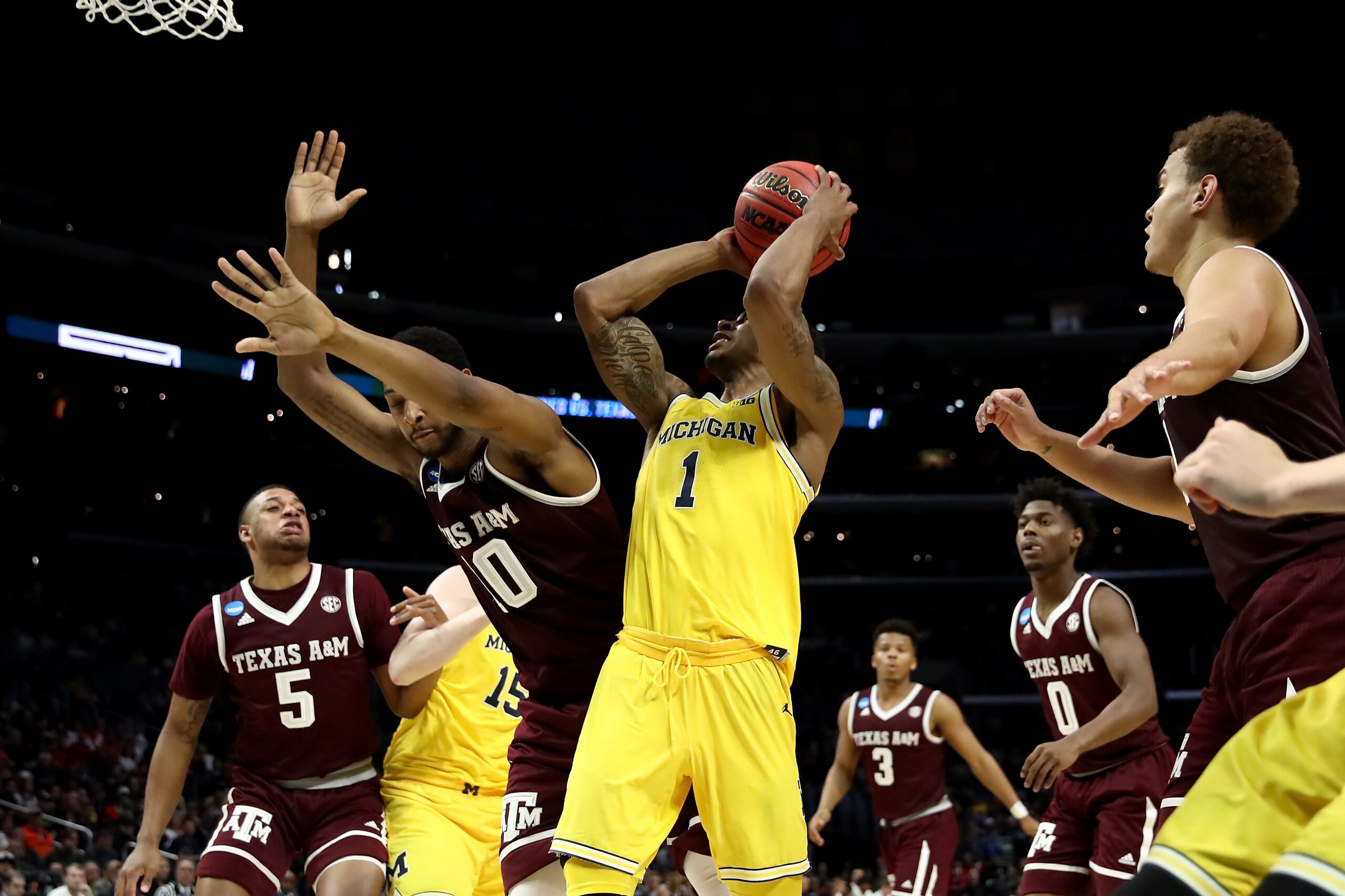 LOS ANGELES, CA - MARCH 22:  Charles Matthews #1 of the Michigan Wolverines goes up for a shot against Tonny Trocha-Morelos #10 of the Texas A&M Aggies in the second half in the 2018 NCAA Men's Basketball Tournament West Regional at Staples Center on Marc