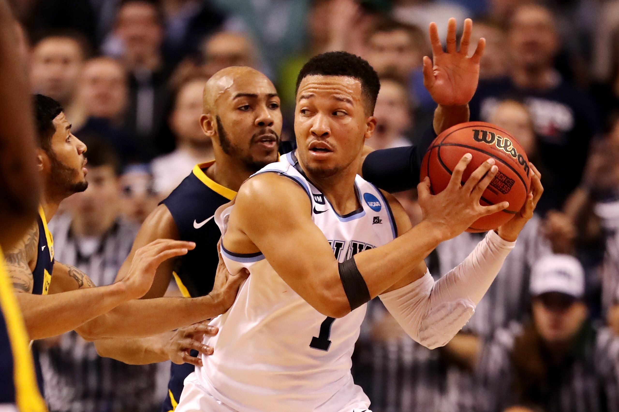 BOSTON, MA - MARCH 23: Jalen Brunson #1 of the Villanova Wildcats is defended by Jevon Carter #2 of the West Virginia Mountaineers during the second half in the 2018 NCAA Men's Basketball Tournament East Regional at TD Garden on March 23, 2018 in Boston, 