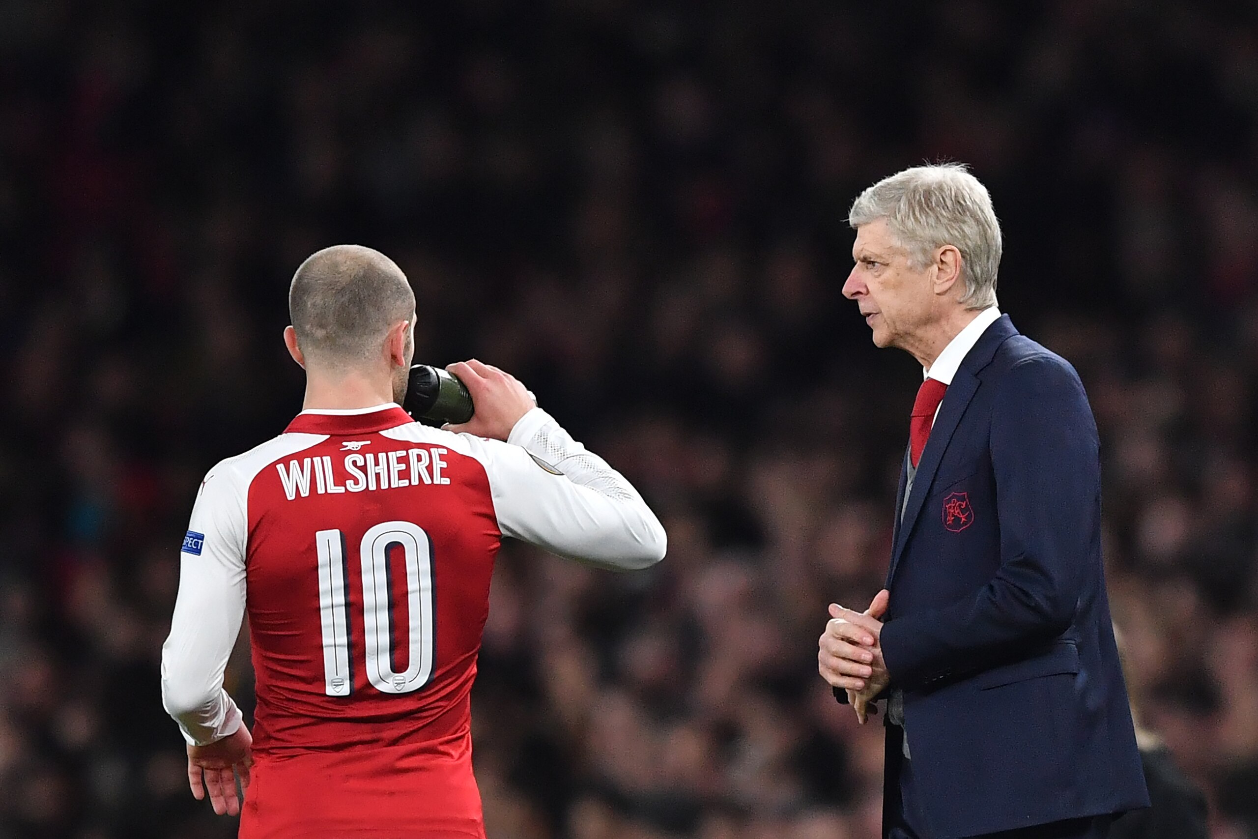 Arsenal's French manager Arsene Wenger (R) talks to Arsenal's English midfielder Jack Wilshere during the UEFA Europa League round of 16 second-leg football match between Arsenal and AC Milan at the Emirates Stadium in London on March 15, 2018. / AFP PH Arsenal's French manager Arsene Wenger (R) talks to Arsenal's English midfielder Jack Wilshere during the UEFA Europa League round of 16 second-leg football match between Arsenal and AC Milan at the Emirates Stadium in London on March 15, 2018. / AFP PH