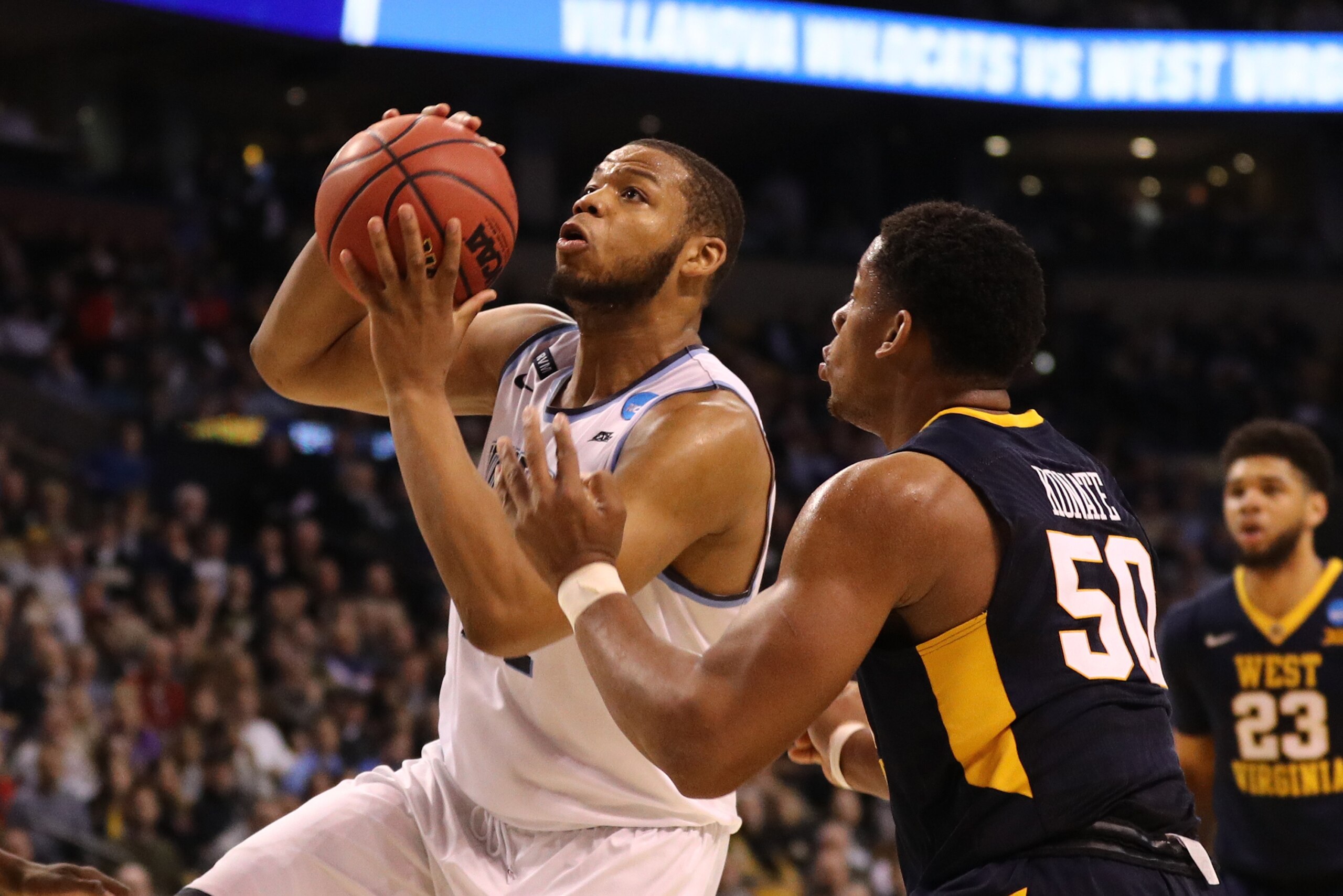 BOSTON, MA - MARCH 23: Omari Spellman #14 of the Villanova Wildcats is defended by Sagaba Konate #50 of the West Virginia Mountaineers during the second half in the 2018 NCAA Men's Basketball Tournament East Regional at TD Garden on March 23, 2018 in Bost