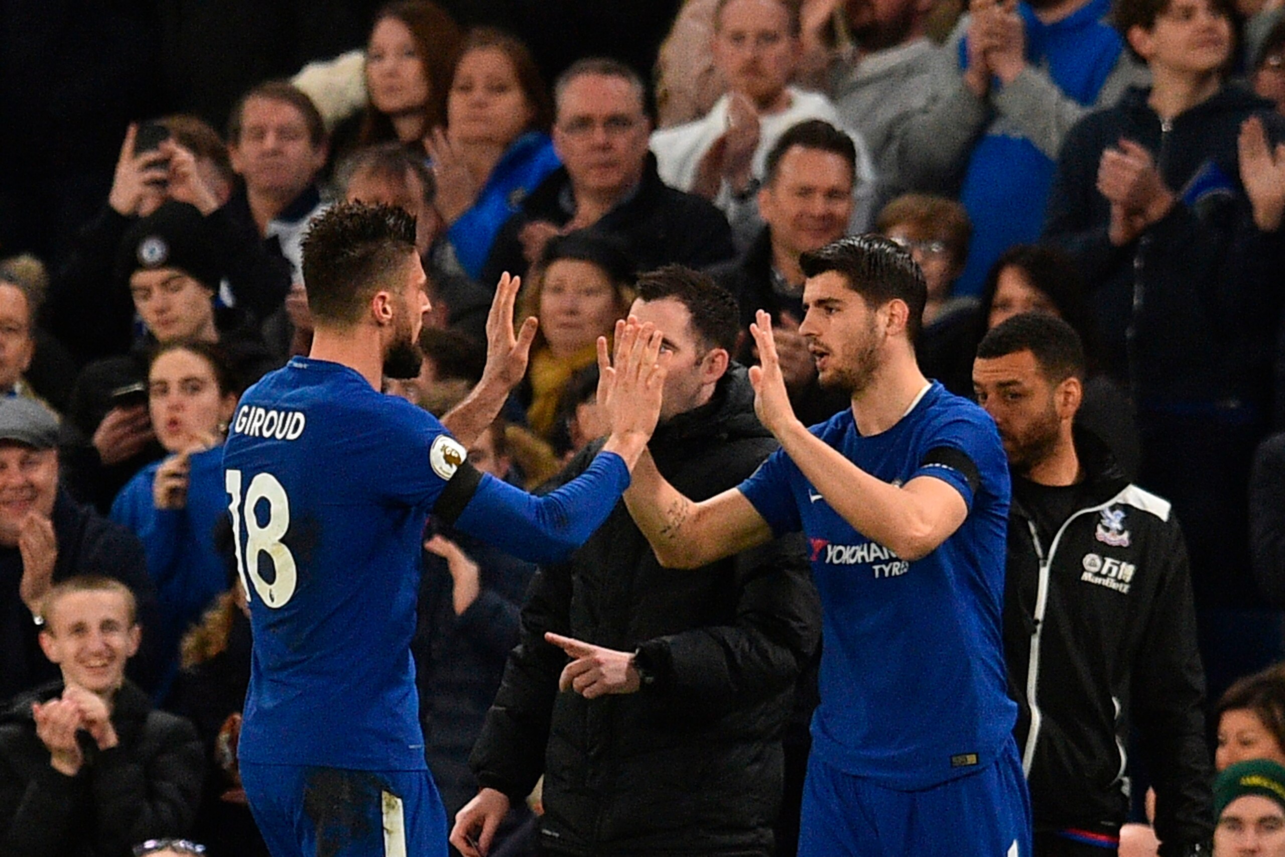 Chelsea's French attacker Olivier Giroud (L) high-fives his replacement Chelsea's Spanish striker Alvaro Morata (R) as he goes off as a substitute during the English Premier League football match between Chelsea and Crystal Palace at Stamford Bridge in Lo Chelsea's French attacker Olivier Giroud (L) high-fives his replacement Chelsea's Spanish striker Alvaro Morata (R) as he goes off as a substitute during the English Premier League football match between Chelsea and Crystal Palace at Stamford Bridge in Lo