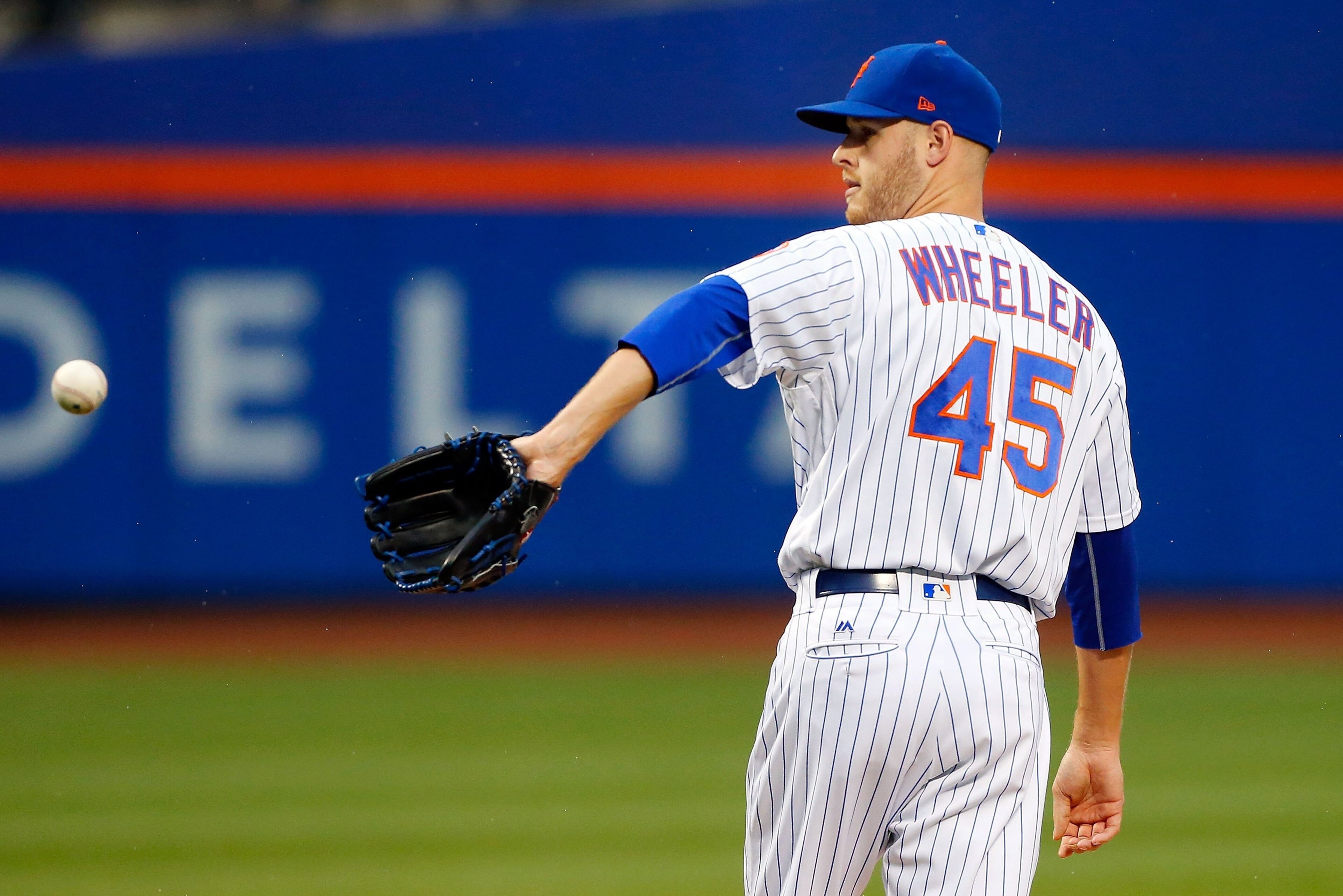 NEW YORK, NY - JULY 22:  Zack Wheeler #45 of the New York Mets in action against the Oakland Athletics at Citi Field on July 22, 2017 in the Flushing neighborhood of the Queens borough of New York City. The Mets defeated the Athletics 6-5.  (Photo by Jim 