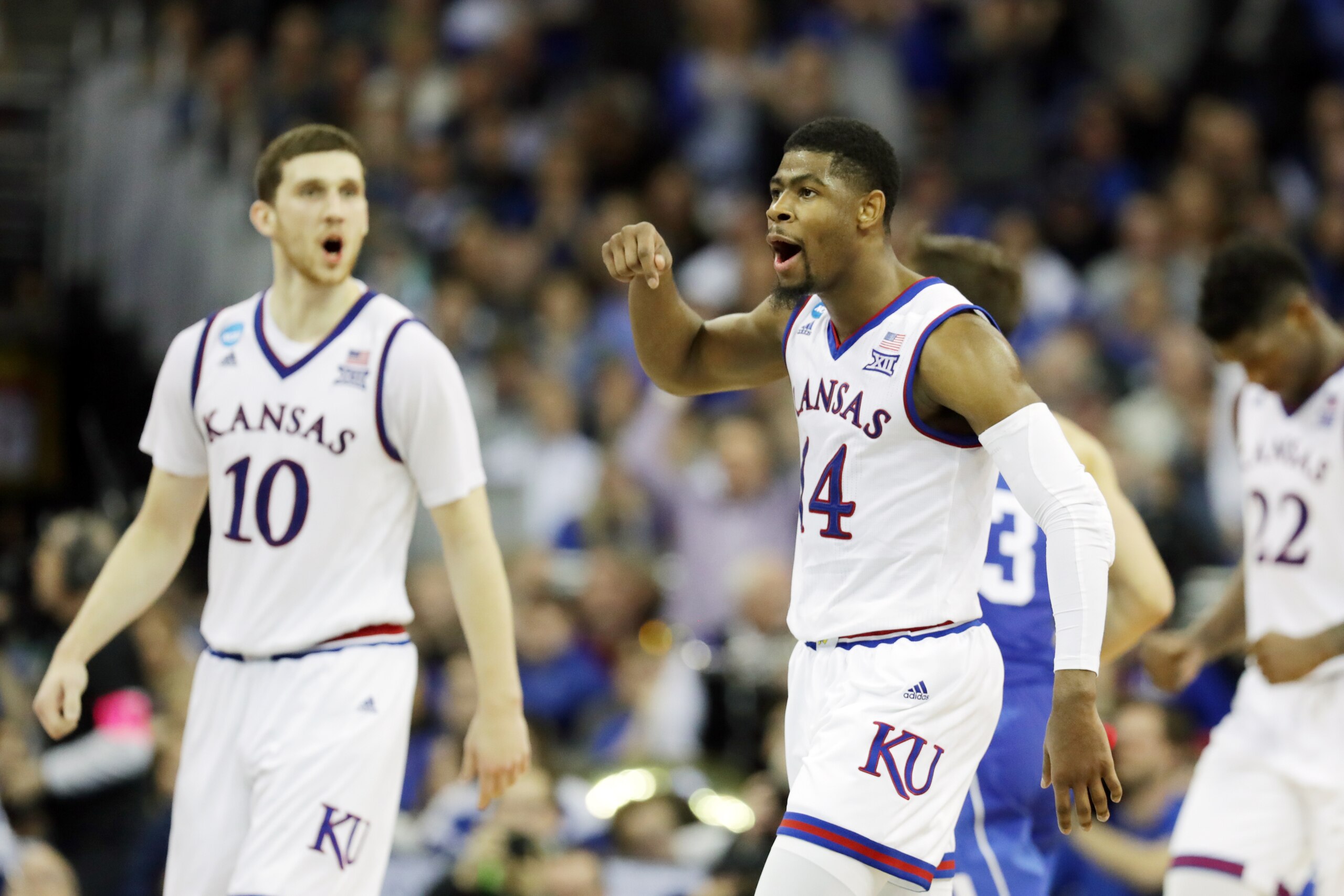 OMAHA, NE - MARCH 25:  Malik Newman #14 of the Kansas Jayhawks celebrates against the Duke Blue Devils during overtime in the 2018 NCAA Men's Basketball Tournament Midwest Regional at CenturyLink Center on March 25, 2018 in Omaha, Nebraska. The Kansas Jay
