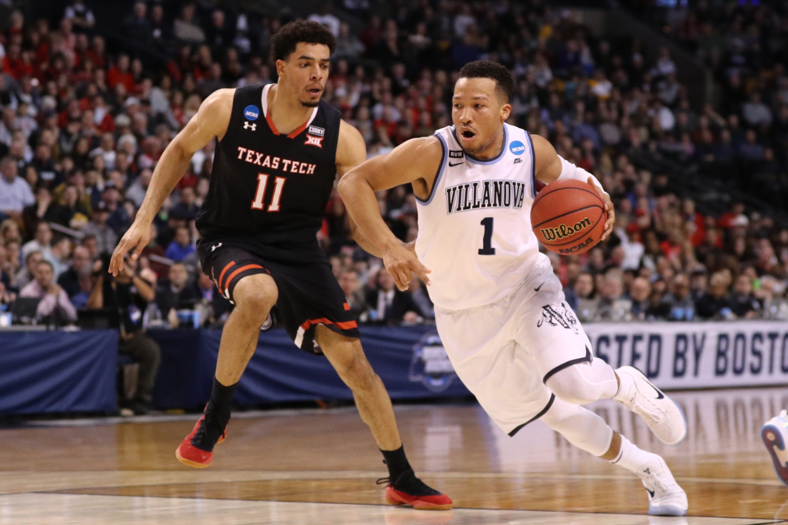 BOSTON, MA - MARCH 25: Jalen Brunson #1 of the Villanova Wildcats is defended by Zach Smith #11 of the Texas Tech Red Raiders during the first half in the 2018 NCAA Men's Basketball Tournament East Regional at TD Garden on March 25, 2018 in Boston, Massac