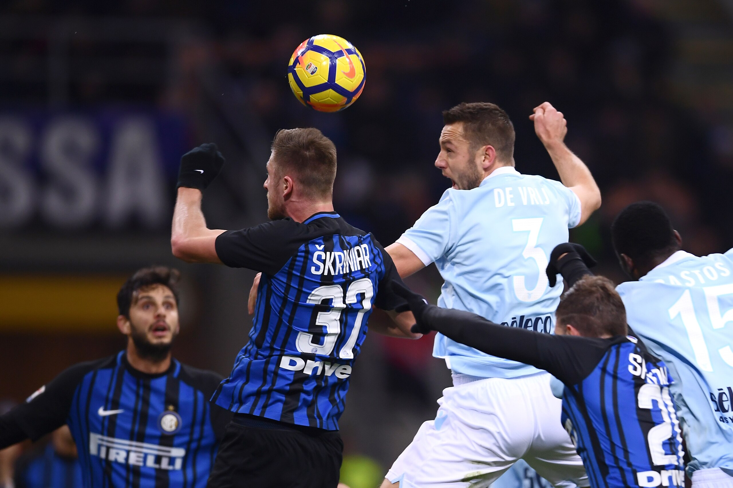 Inter Milan's defender Milan Skriniar from Slovenia jumps (2nd L) for the ball with Lazio's defender Stefan De Vrij from Netherlands (R) during the Italian Serie A football match Inter Milan Vs Lazio on December 30, 2017 at the 'San Siro Stadium' in Mila Inter Milan's defender Milan Skriniar from Slovenia jumps (2nd L) for the ball with Lazio's defender Stefan De Vrij from Netherlands (R) during the Italian Serie A football match Inter Milan Vs Lazio on December 30, 2017 at the 'San Siro Stadium' in Mila