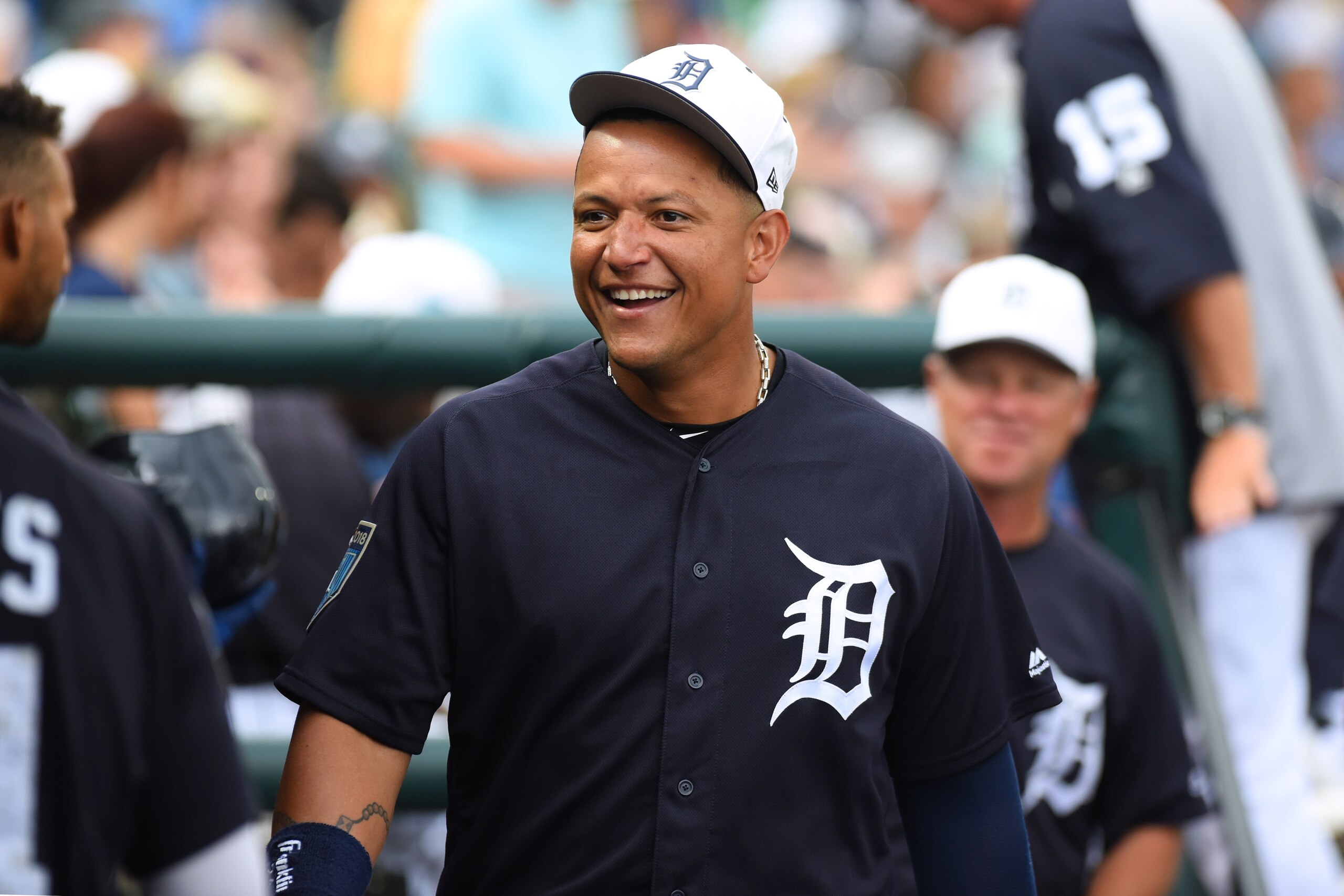 LAKELAND, FL - MARCH 20:  Miguel Cabrera #24 of the Detroit Tigers looks on from the dugout and smiles during the Spring Training game against the New York Yankees at Publix Field at Joker Marchant Stadium on March 20, 2018 in Lakeland, Florida. The Tiger