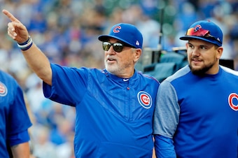 CHICAGO, IL - SEPTEMBER 17:  Manager Joe Maddon #70 (L) talks with Kyle Schwarber #12 after their game against the St. Louis Cardinals at Wrigley Field on September 17, 2017 in Chicago, Illinois. The Chicago Cubs won 4-3.  (Photo by Jon Durr/Getty Images)