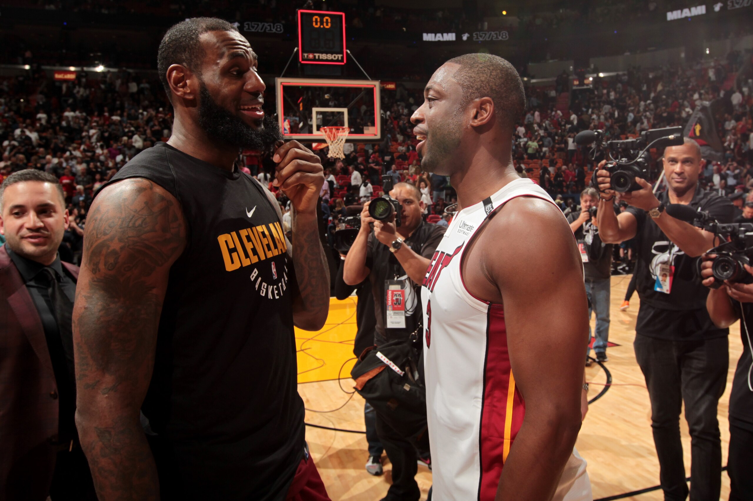 MIAMI, FL - MARCH 27:  LeBron James #23 of the Cleveland Cavaliers and Dwyane Wade #3 of the Miami Heat meet after the game between the two teams on March 27, 2018 at American Airlines Arena in Miami, Florida. NOTE TO USER: User expressly acknowledges and