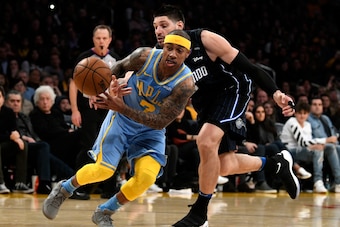 LOS ANGELES, CA - MARCH 07:  Isaiah Thomas #7 of the Los Angeles Lakers plays against Nikola Vucevic #9 of the Orlando Magic on March 7, 2018 at STAPLES Center in Los Angeles, California. NOTE TO USER: User expressly acknowledges and agrees that, by downl