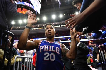 PHILADELPHIA,PA -  MARCH 26 : Markelle Fultz #20 of the Philadelphia 76ers runs into the locker room while shaking fans hands against the Denver Nuggets at Wells Fargo Center on March 26, 2018 in Philadelphia, Pennsylvania NOTE TO USER: User expressly ack