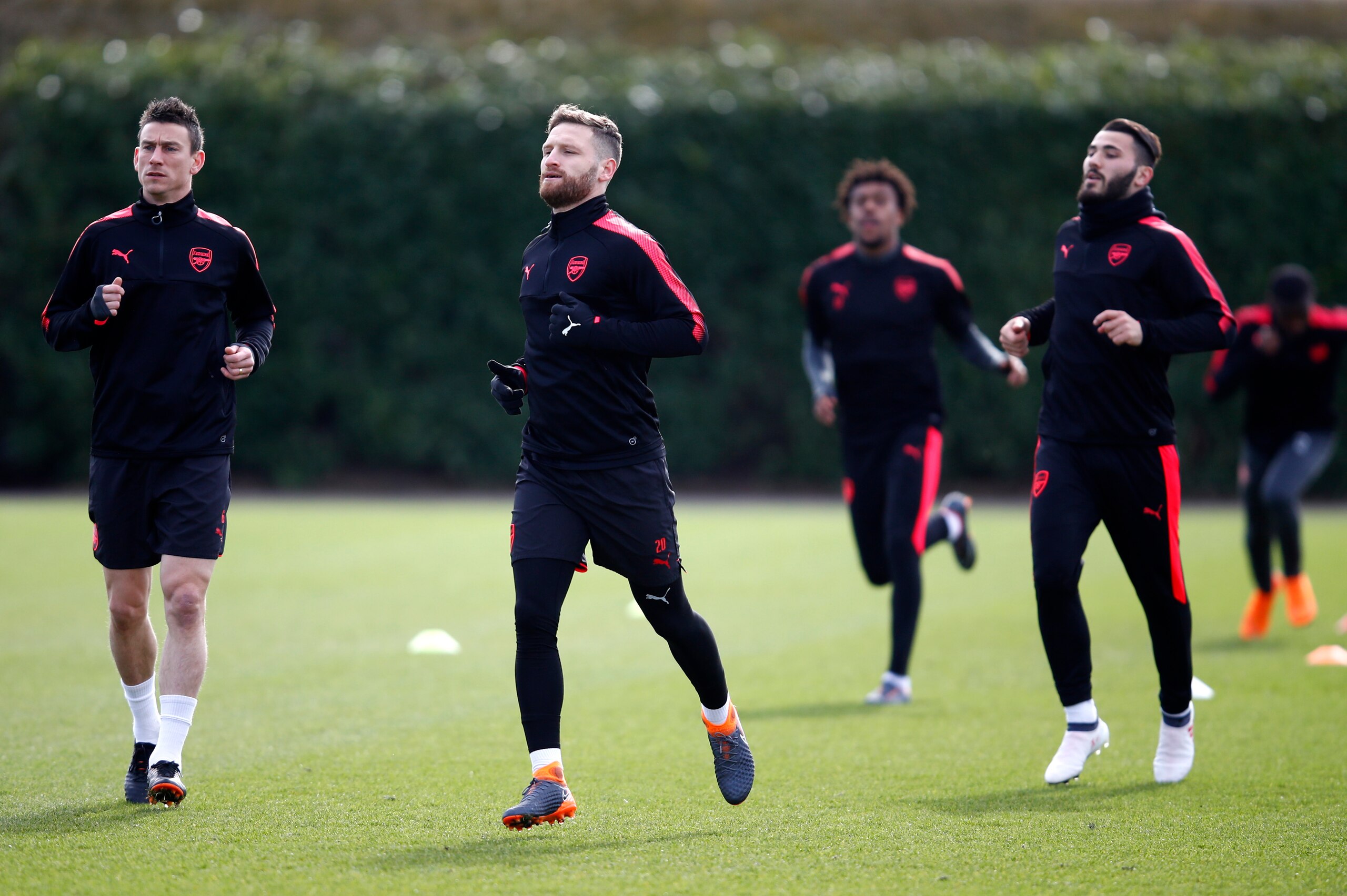 ST ALBANS, ENGLAND - MARCH 14: Laurent Koscielny, Shkodran Mustafi and Sead Kolasinac of Arsenal during an Arsenal Training Session ahead of there Europa League 2nd Leg match against AC Milan at London Colney on March 14, 2018 in St Albans, England. (Ph ST ALBANS, ENGLAND - MARCH 14: Laurent Koscielny, Shkodran Mustafi and Sead Kolasinac of Arsenal during an Arsenal Training Session ahead of there Europa League 2nd Leg match against AC Milan at London Colney on March 14, 2018 in St Albans, England. (Ph