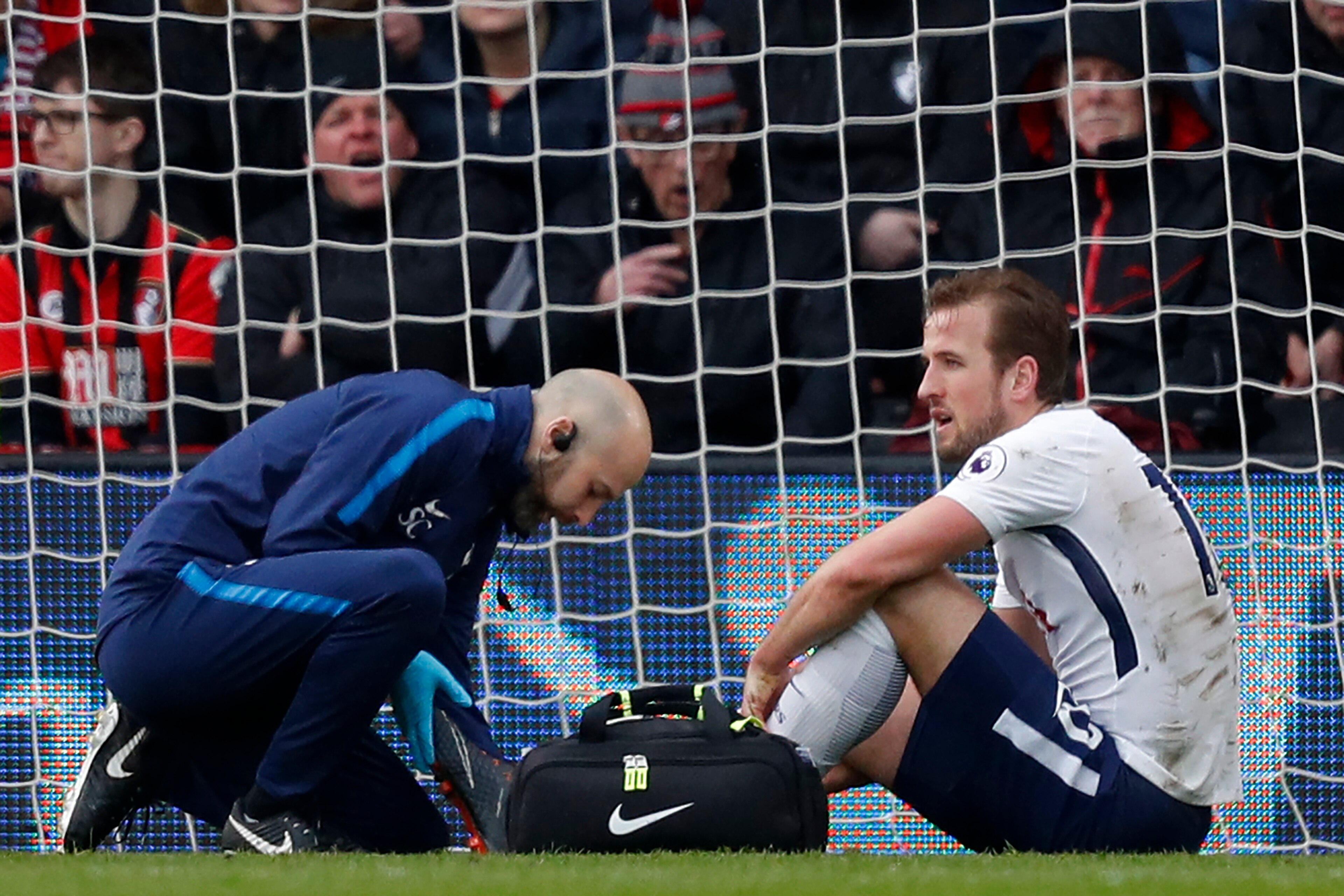 Tottenham Hotspur's English striker Harry Kane (R) receives medical attention after picking up an injury during the English Premier League football match between Bournemouth and Tottenham Hotspur at the Vitality Stadium in Bournemouth, southern England on Tottenham Hotspur's English striker Harry Kane (R) receives medical attention after picking up an injury during the English Premier League football match between Bournemouth and Tottenham Hotspur at the Vitality Stadium in Bournemouth, southern England on