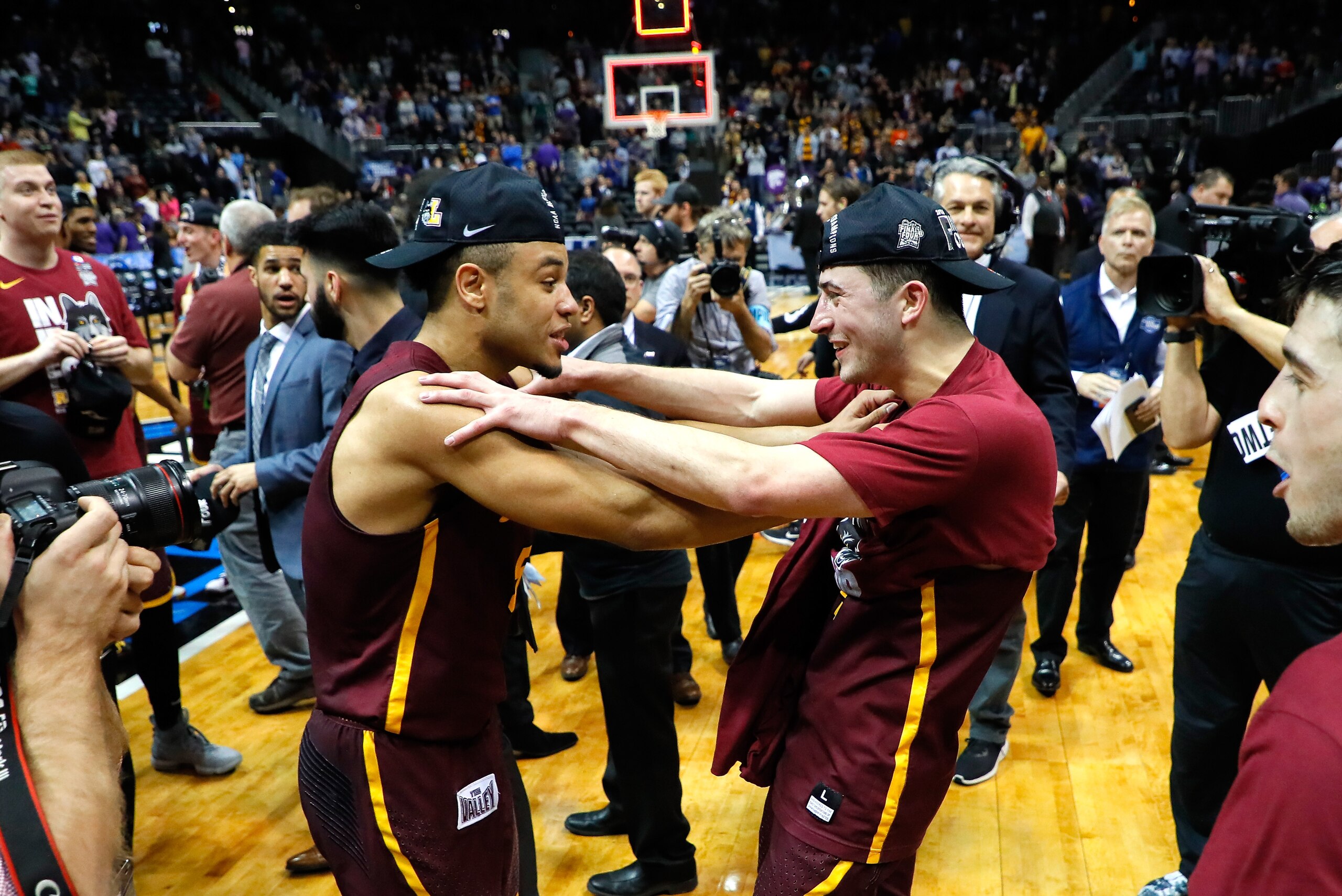 ATLANTA, GA - MARCH 24:  Marques Townes #5 and Ben Richardson #14 of the Loyola Ramblers celebrate after defeating the Kansas State Wildcats during the 2018 NCAA Men's Basketball Tournament South Regional at Philips Arena on March 24, 2018 in Atlanta, Geo