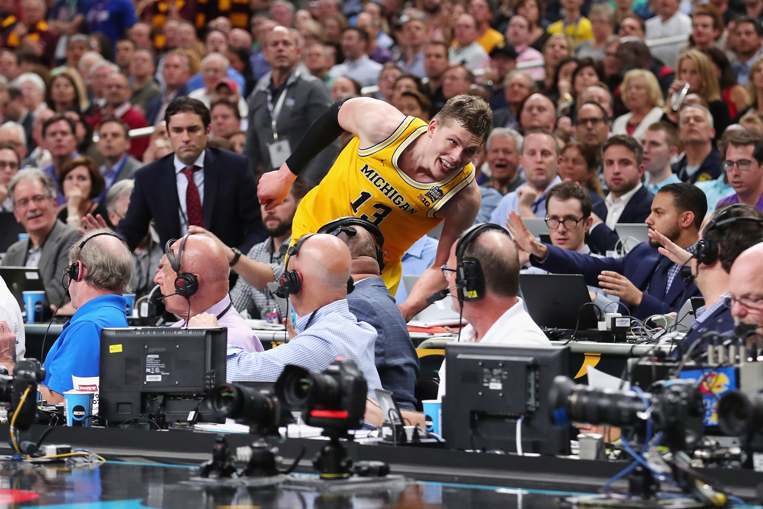 SAN ANTONIO, TX - MARCH 31:  Moritz Wagner #13 of the Michigan Wolverines jumps off the court in the second half against the Loyola Ramblers during the 2018 NCAA Men's Final Four Semifinal at the Alamodome on March 31, 2018 in San Antonio, Texas.  (Photo 