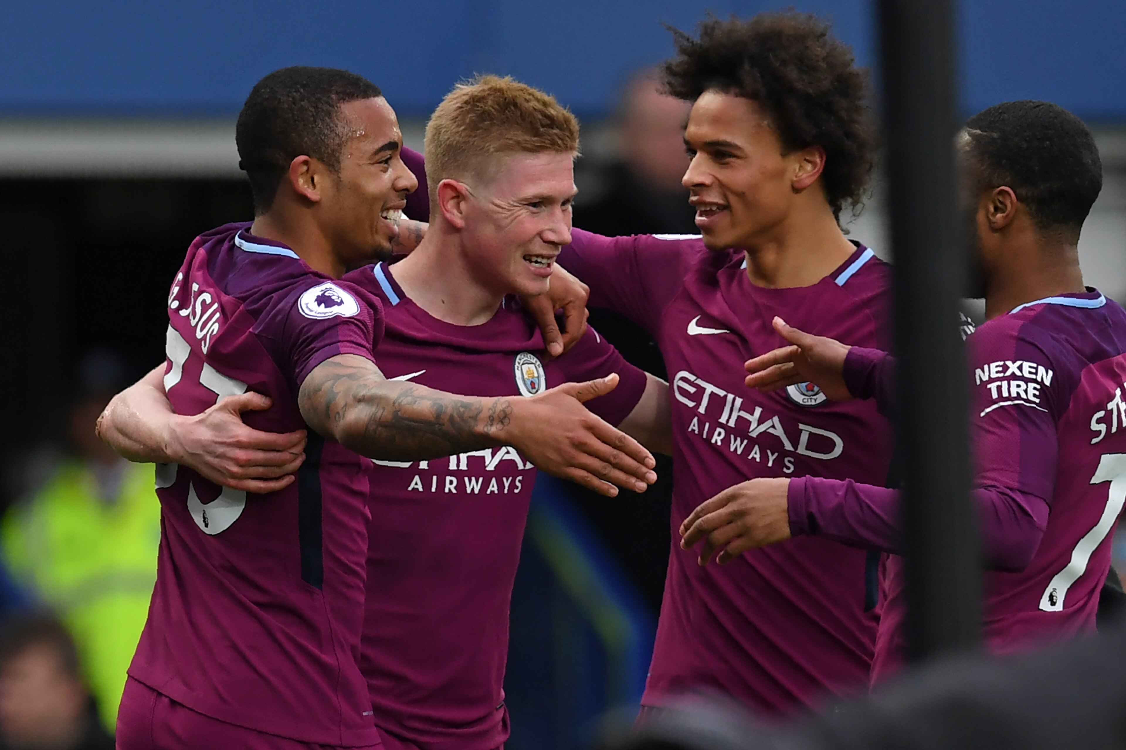 Manchester City's Brazilian striker Gabriel Jesus (L) celebrates with teammates after scoring their second goal during the English Premier League football match between Everton and Manchester City at Goodison Park in Liverpool, north west England on March