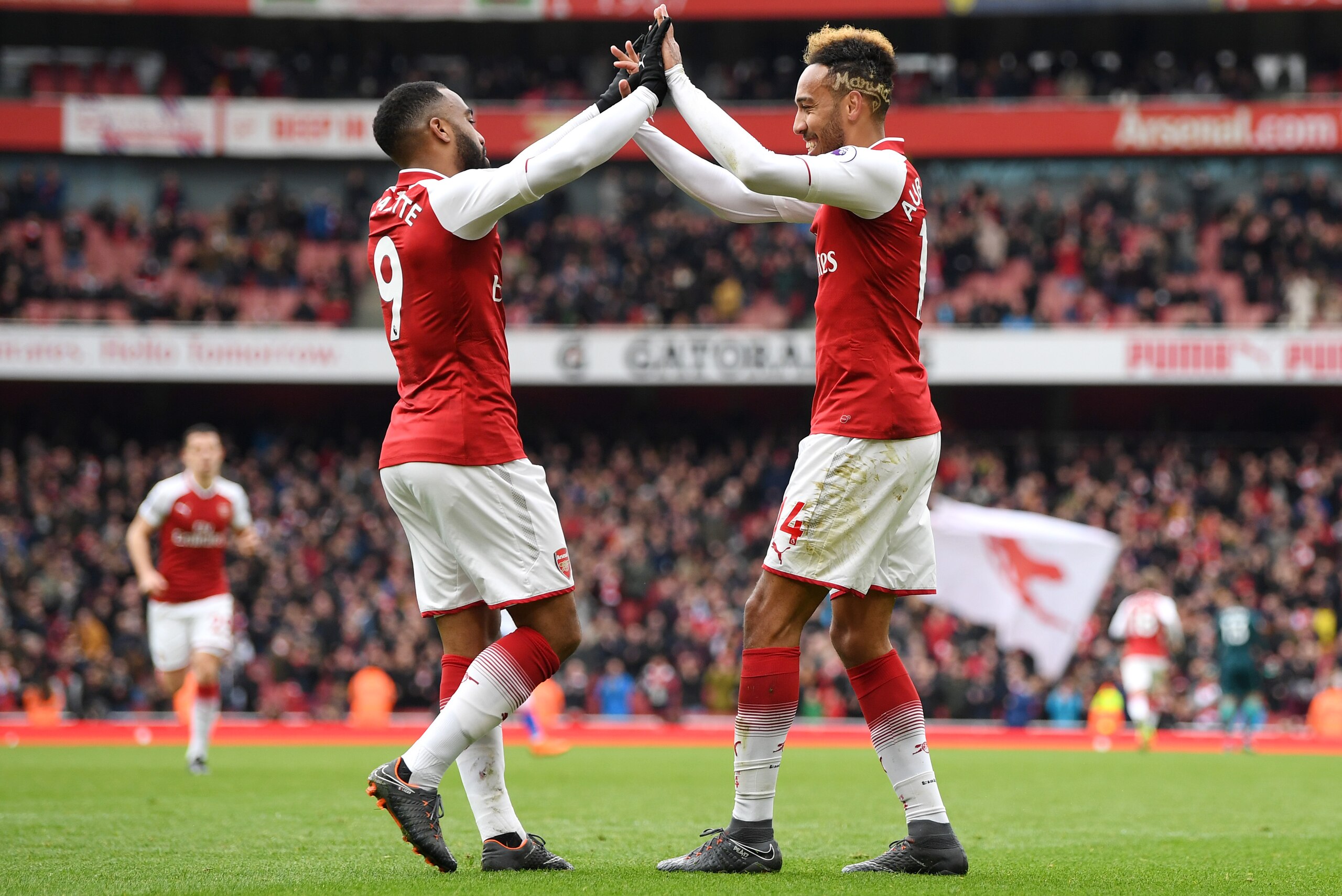 LONDON, ENGLAND - APRIL 01: Pierre-Emerick Aubameyang of Arsenal celebrates after scoring his sides second goal with Alexandre Lacazette of Arsenal during the Premier League match between Arsenal and Stoke City at Emirates Stadium on April 1, 2018 in Lond