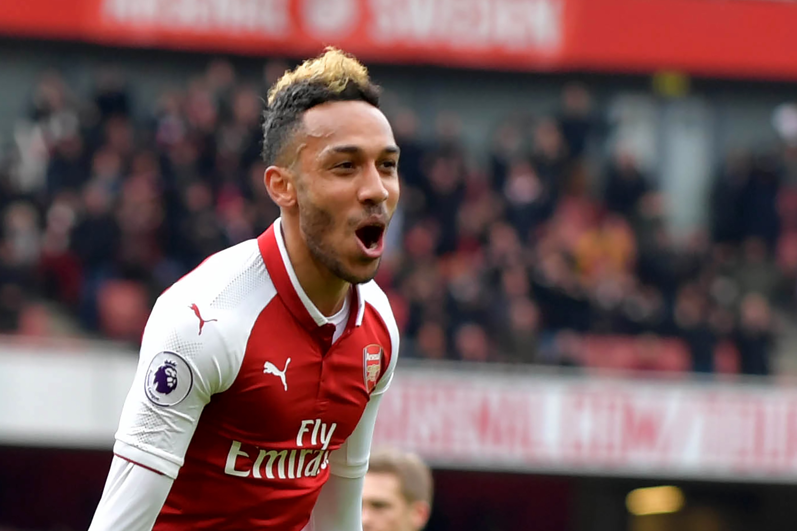 Arsenal's Gabonese striker Pierre-Emerick Aubameyang celebrates scoring the team's second goal during the English Premier League football match between Arsenal and Stoke City at the Emirates Stadium in London on April 1, 2018.  / AFP PHOTO / Oliver GREENW