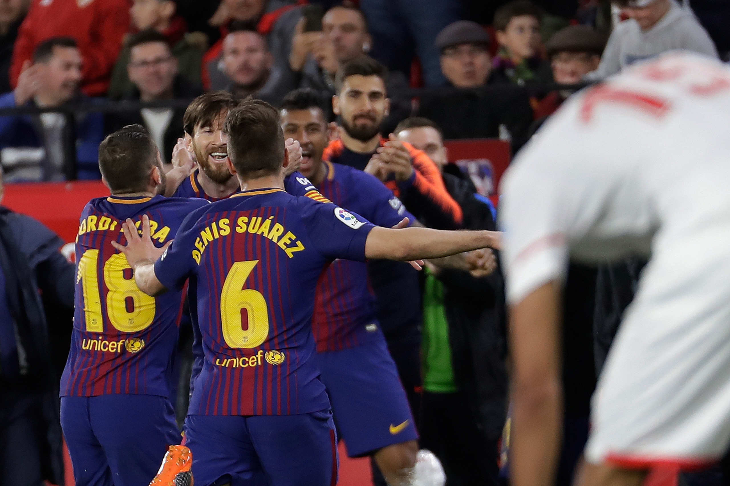 SEVILLA, SPAIN - MARCH 31: Lionel Messi of FC Barcelona celebrates 2-2 with Jordi Alba of FC Barcelona, Denis Suarez of FC Barcelona  during the La Liga Santander  match between Sevilla v FC Barcelona at the Estadio Ramon Sanchez Pizjuan on March 31, 2018