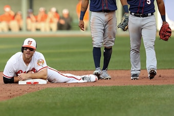 BALTIMORE, MD - MARCH 29: Chris Davis #19 of the Baltimore Orioles looks on from second base during the tenth inning against the Minnesota Twins in their Opening Day game at Oriole Park at Camden Yards on March 29, 2018 in Baltimore, Maryland. (Photo by P