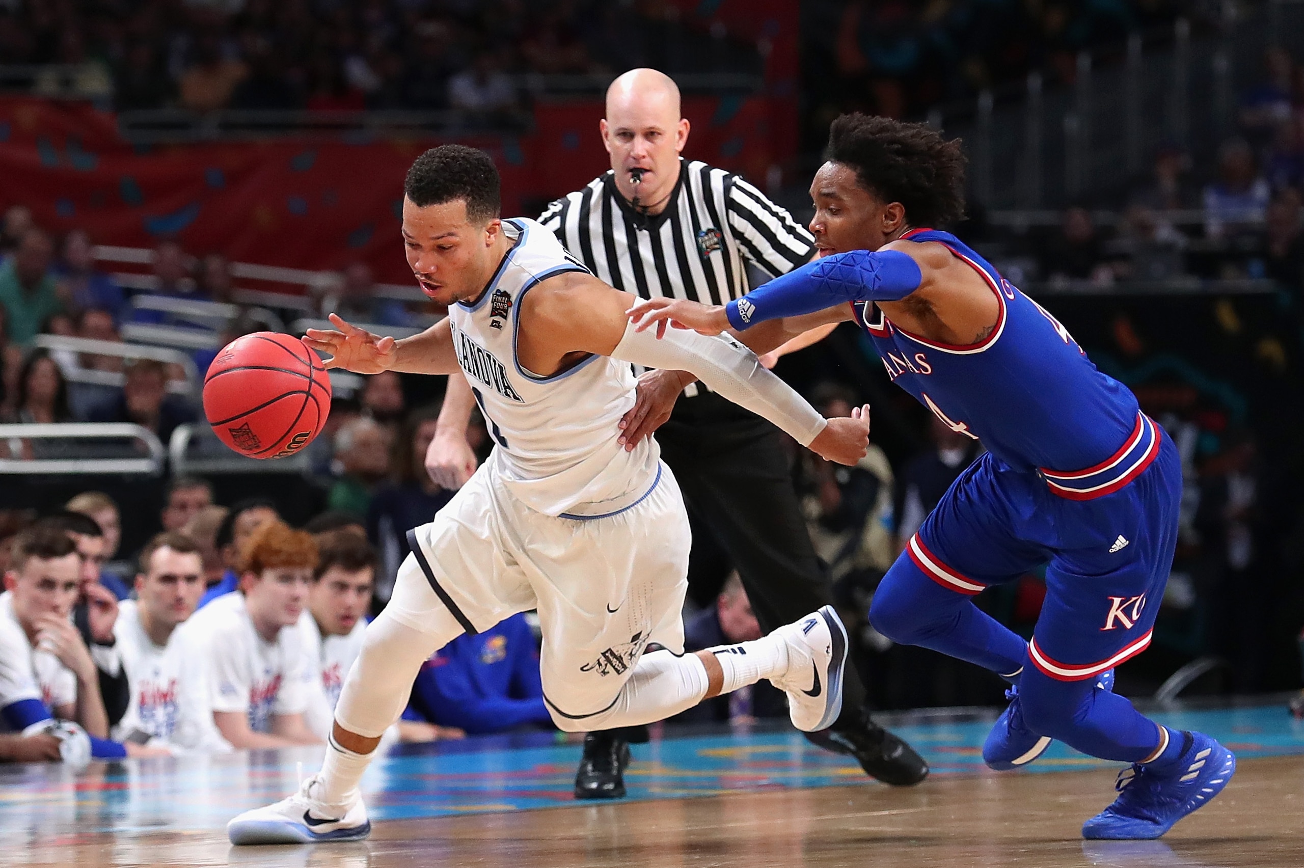 SAN ANTONIO, TX - MARCH 31:  Jalen Brunson #1 of the Villanova Wildcats handles the ball against Devonte' Graham #4 of the Kansas Jayhawks in the second half during the 2018 NCAA Men's Final Four Semifinal at the Alamodome on March 31, 2018 in San Antonio