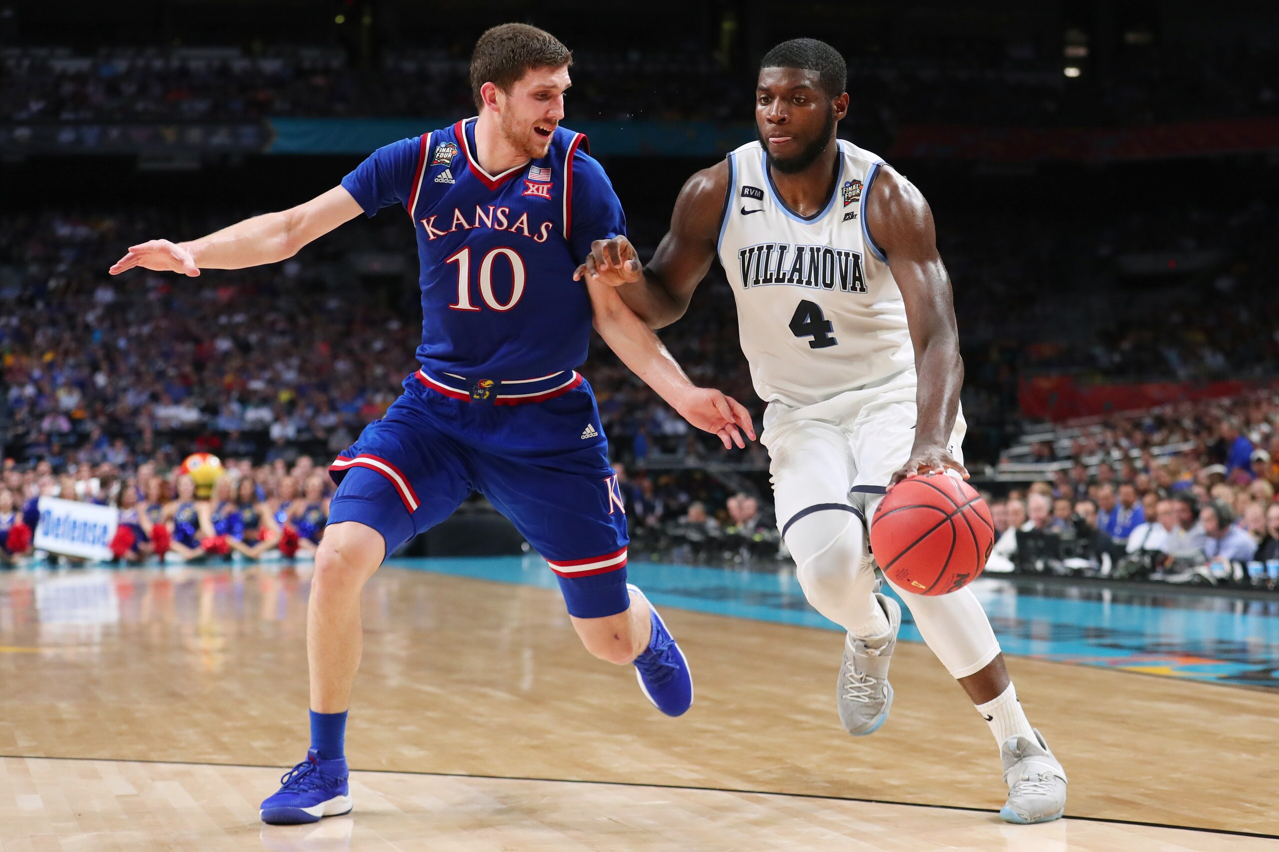 SAN ANTONIO, TX - MARCH 31:  Eric Paschall #4 of the Villanova Wildcats is defended by Sviatoslav Mykhailiuk #10 of the Kansas Jayhawks in the second half during the 2018 NCAA Men's Final Four Semifinal at the Alamodome on March 31, 2018 in San Antonio, T