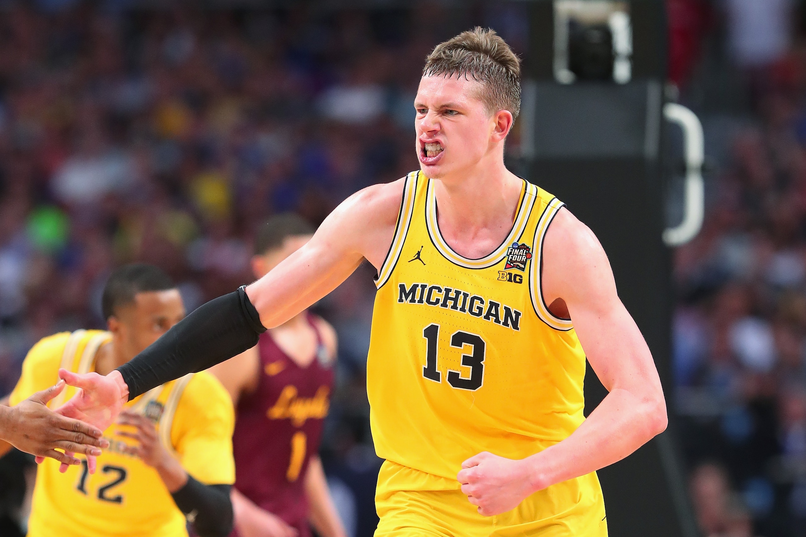 SAN ANTONIO, TX - MARCH 31:  Moritz Wagner #13 of the Michigan Wolverines reacts in the first half against the Loyola Ramblers during the 2018 NCAA Men's Final Four Semifinal at the Alamodome on March 31, 2018 in San Antonio, Texas.  (Photo by Tom Penning
