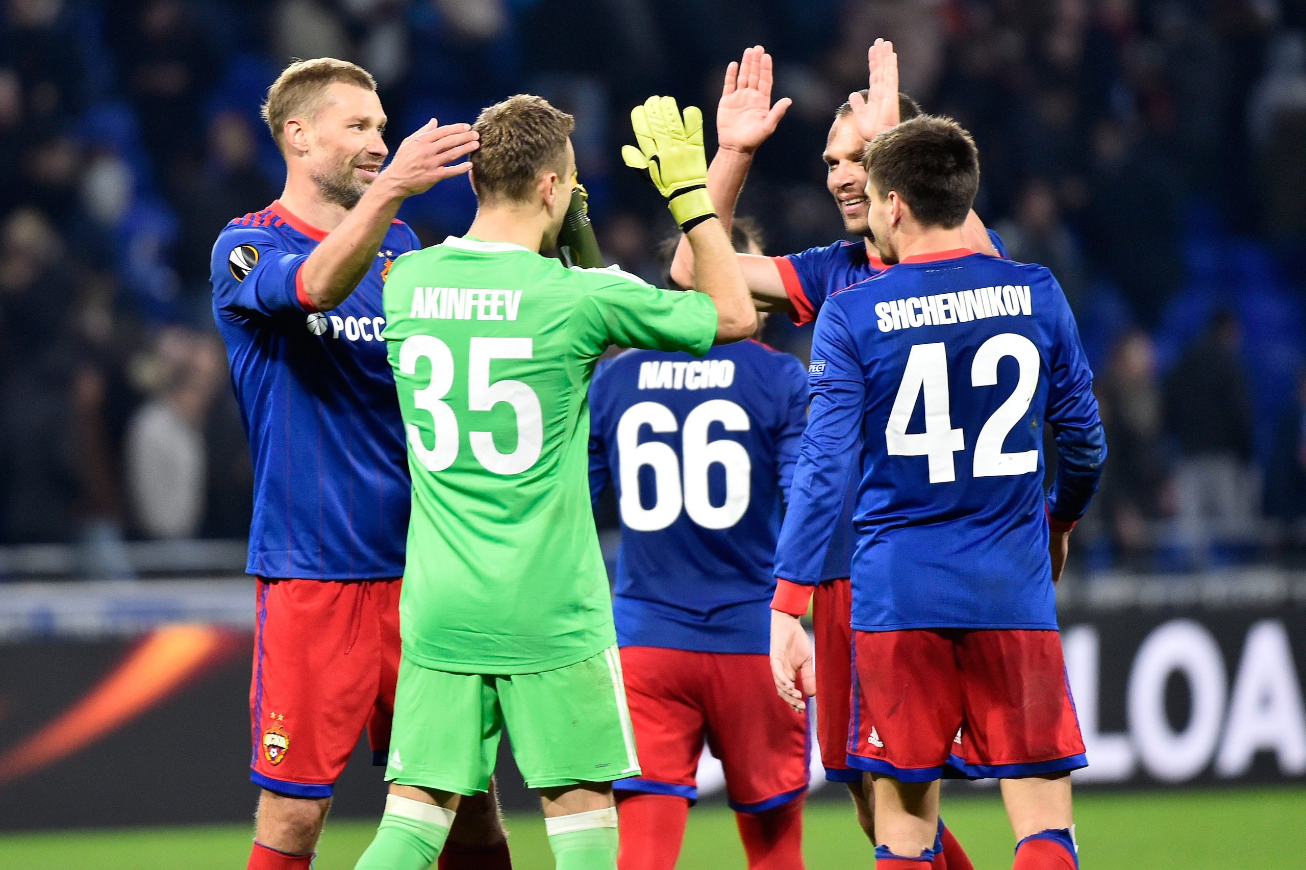 Moscow's players celebrate during the UEFA Europa League round of 16 football match between Lyon (OL) and Moscow (CSKA Moscow) at the Groupama stadium in Decines-Charpieu near Lyon, central-eastern France, on March 15, 2018.  / AFP PHOTO / ROMAIN LAFABREG