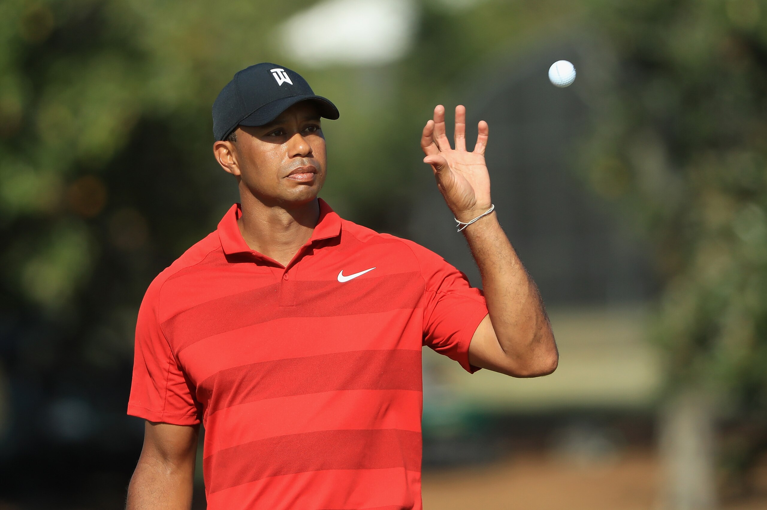ORLANDO, FL - MARCH 18:  Tiger Woods catches a ball on the 15th green during the final round at the Arnold Palmer Invitational Presented By MasterCard at Bay Hill Club and Lodge on March 18, 2018 in Orlando, Florida.  (Photo by Sam Greenwood/Getty Images)