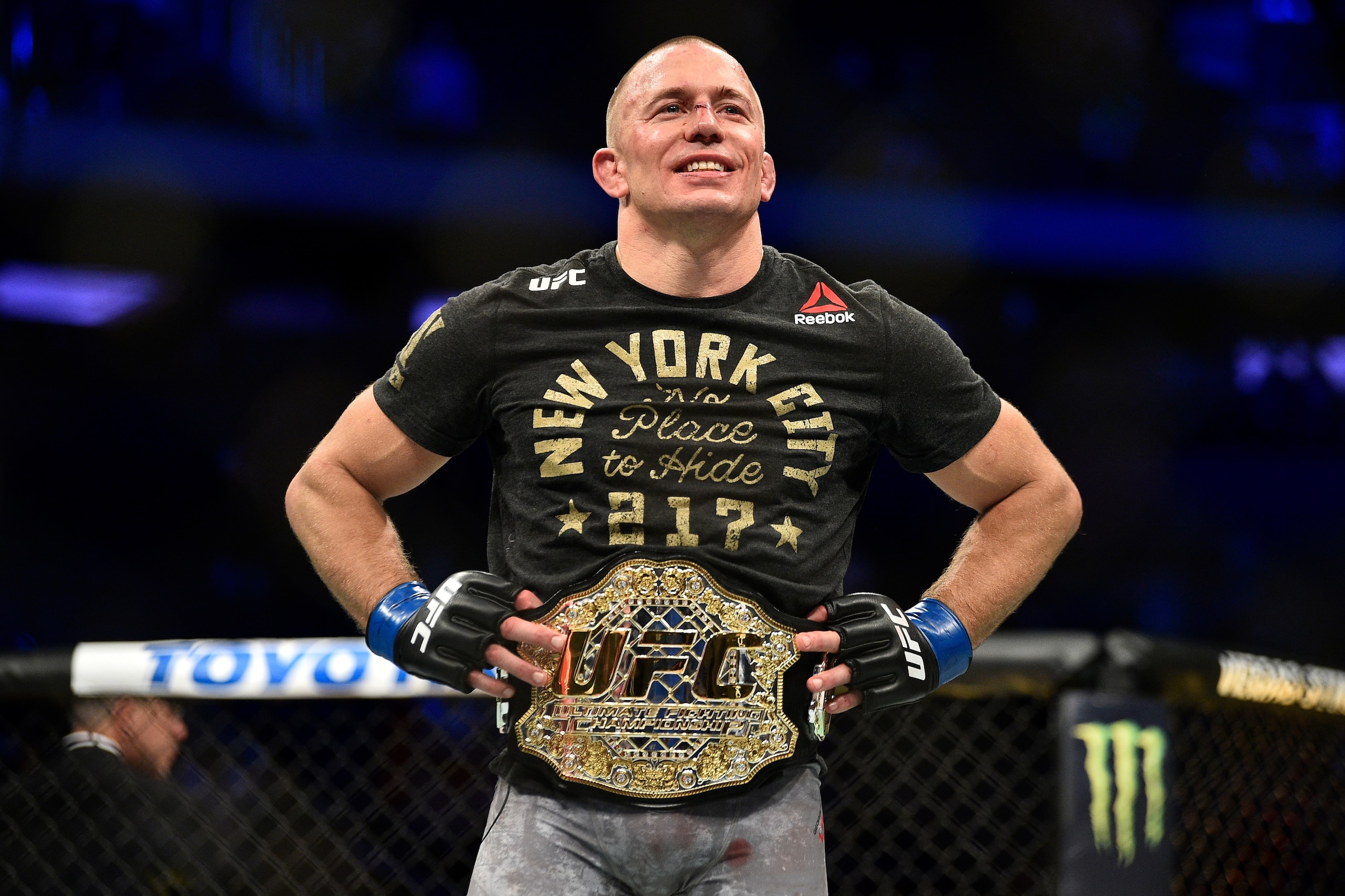 NEW YORK, NY - NOVEMBER 04:  Georges St-Pierre of Canada celebrates after defeating Michael Bisping of England in their UFC middleweight championship bout during the UFC 217 event inside Madison Square Garden on November 4, 2017 in New York City. (Photo b
