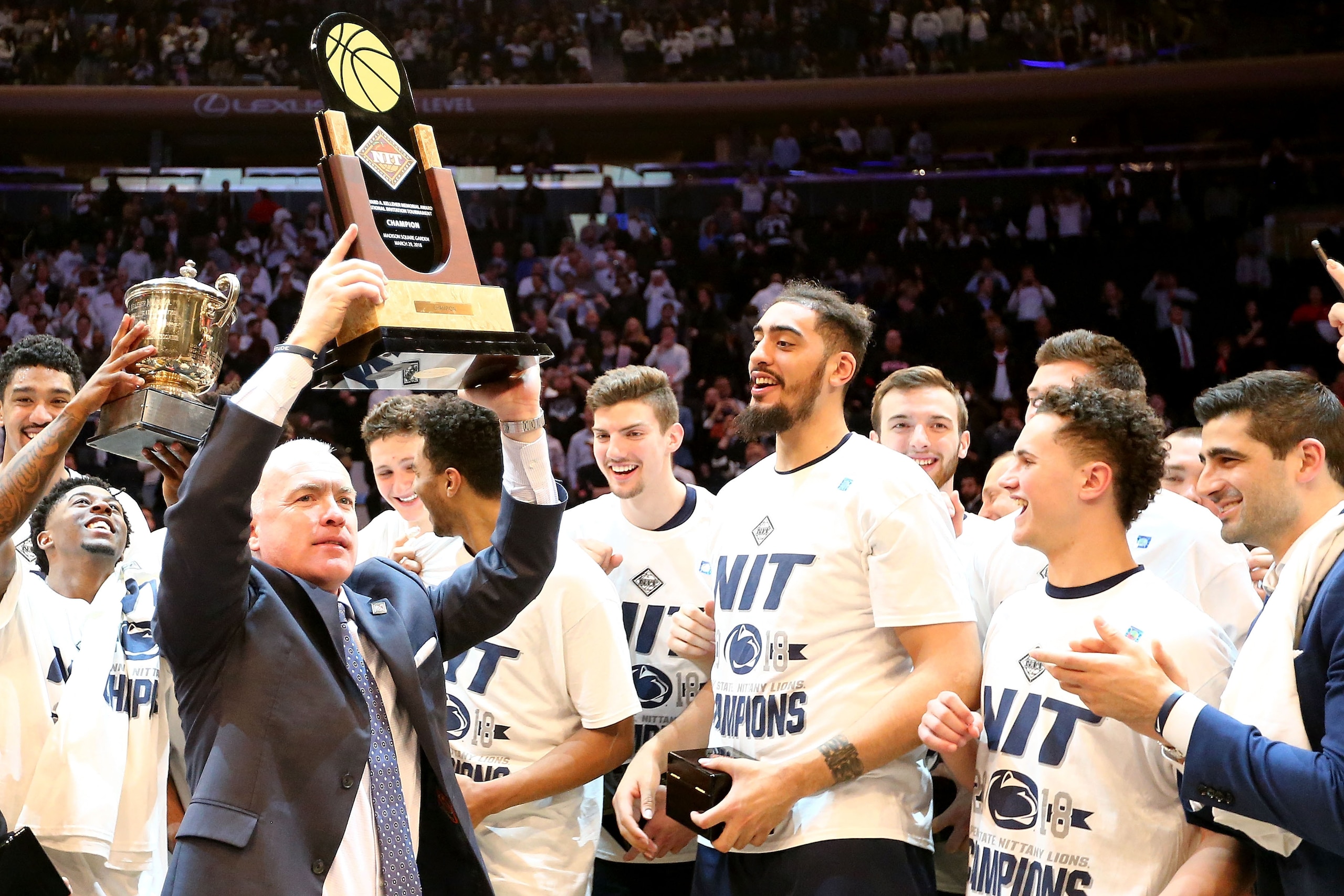 NEW YORK, NY - MARCH 29: Head coach Pat Chambers of the Penn State Nittany Lions celebrates with his team after defeating the Utah Utes 82-66 during the 2018 NIT Championship game at Madison Square Garden on March 29, 2018 in New York City.  (Photo by Abb