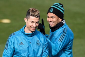 Real Madrid's Portuguese forward Cristiano Ronaldo (L) and Real Madrid's Brazilian midfielder Casemiro attend a training session at Valdebebas Sport City in Madrid on February 13, 2018 on the eve of their Champions' League football match against Paris Sai