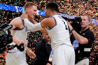 DiVincenzo and Brunson embrace after a historic night.