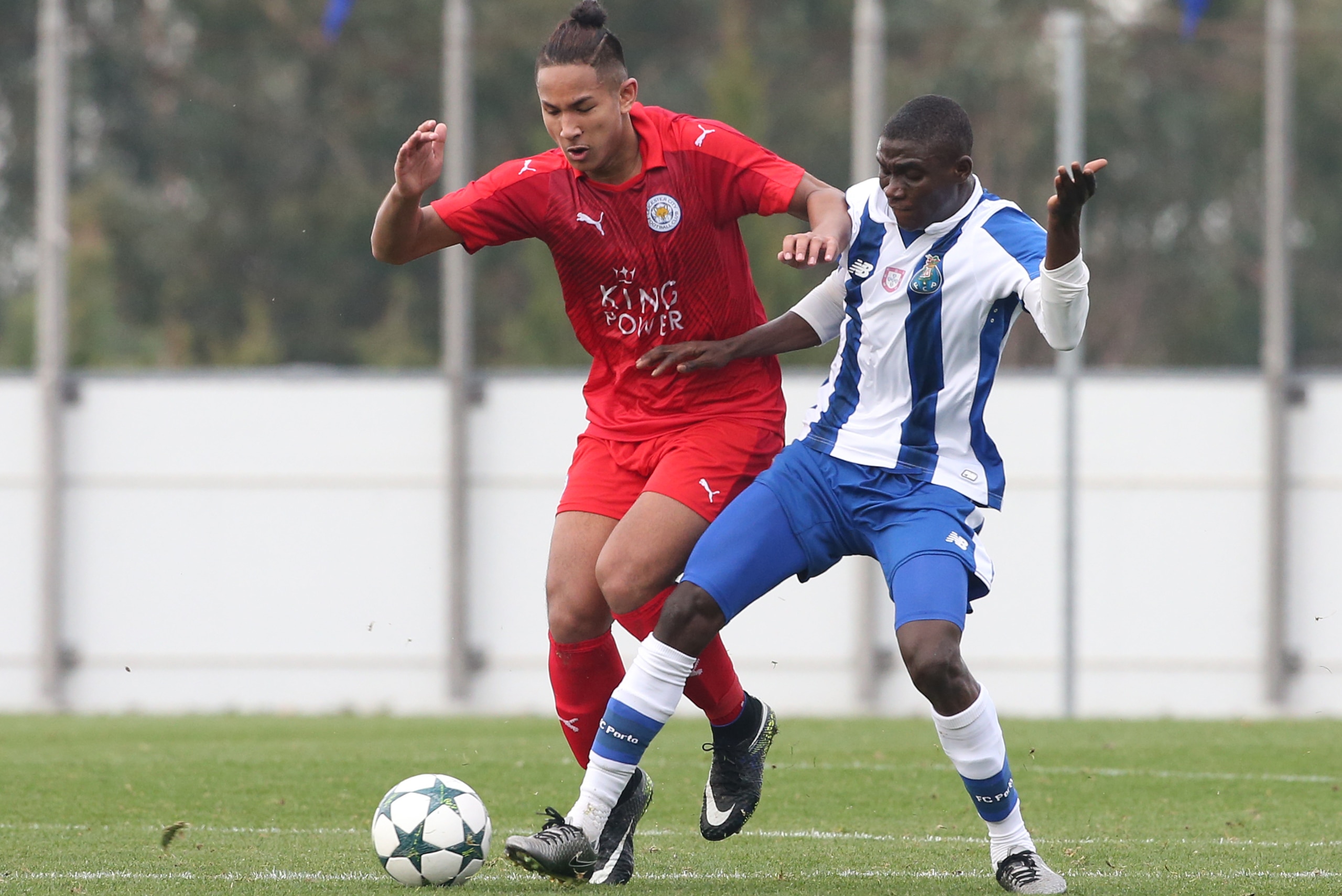 OLIVAL, PORTUGAL - DECEMBER 7:  FC Porto's forward James Artur (R) with Faiq Bolkiah of Leicester City FC (L) in action during the UEFA Youth Champions League match between FC Porto and Leicester City FC at Centro de Estagios do Olival on December 7, 2016