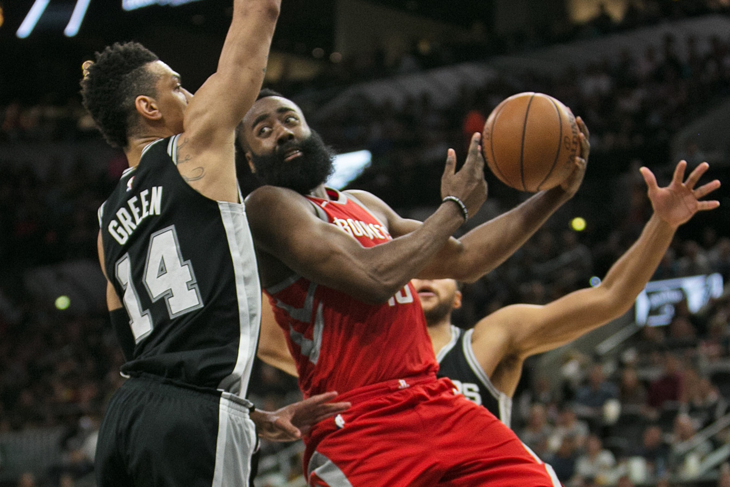 SAN ANTONIO,TX - APRIL 1 : James Harden #13 of the Houston Rockets looks to pass after being stopped by Danny Green #14 of the San Antonio Spurs at AT&T Center on April 1 , 2018 in San Antonio, Texas. NOTE TO USER: User expressly acknowledges and agrees t