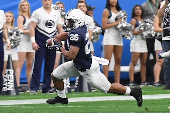 GLENDALE, AZ - DECEMBER 30:  Saquon Barkley #26 of Penn State Nittany Lions runs with the ball against the Washington Huskies during the Playstation Fiesta Bowl at University of Phoenix Stadium on December 30, 2017 in Glendale, Arizona.  (Photo by Norm Ha