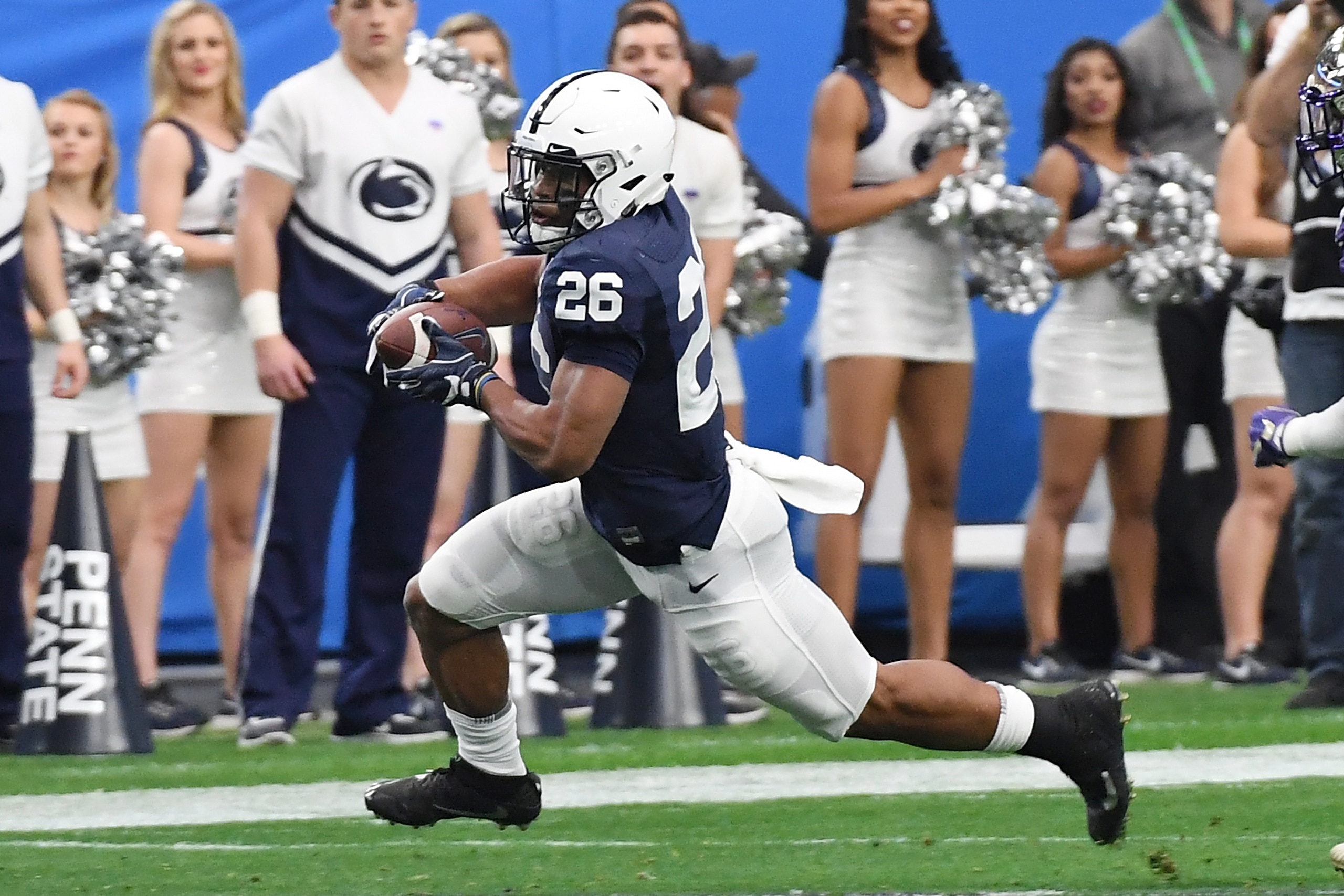 GLENDALE, AZ - DECEMBER 30:  Saquon Barkley #26 of Penn State Nittany Lions runs with the ball against the Washington Huskies during the Playstation Fiesta Bowl at University of Phoenix Stadium on December 30, 2017 in Glendale, Arizona.  (Photo by Norm Ha