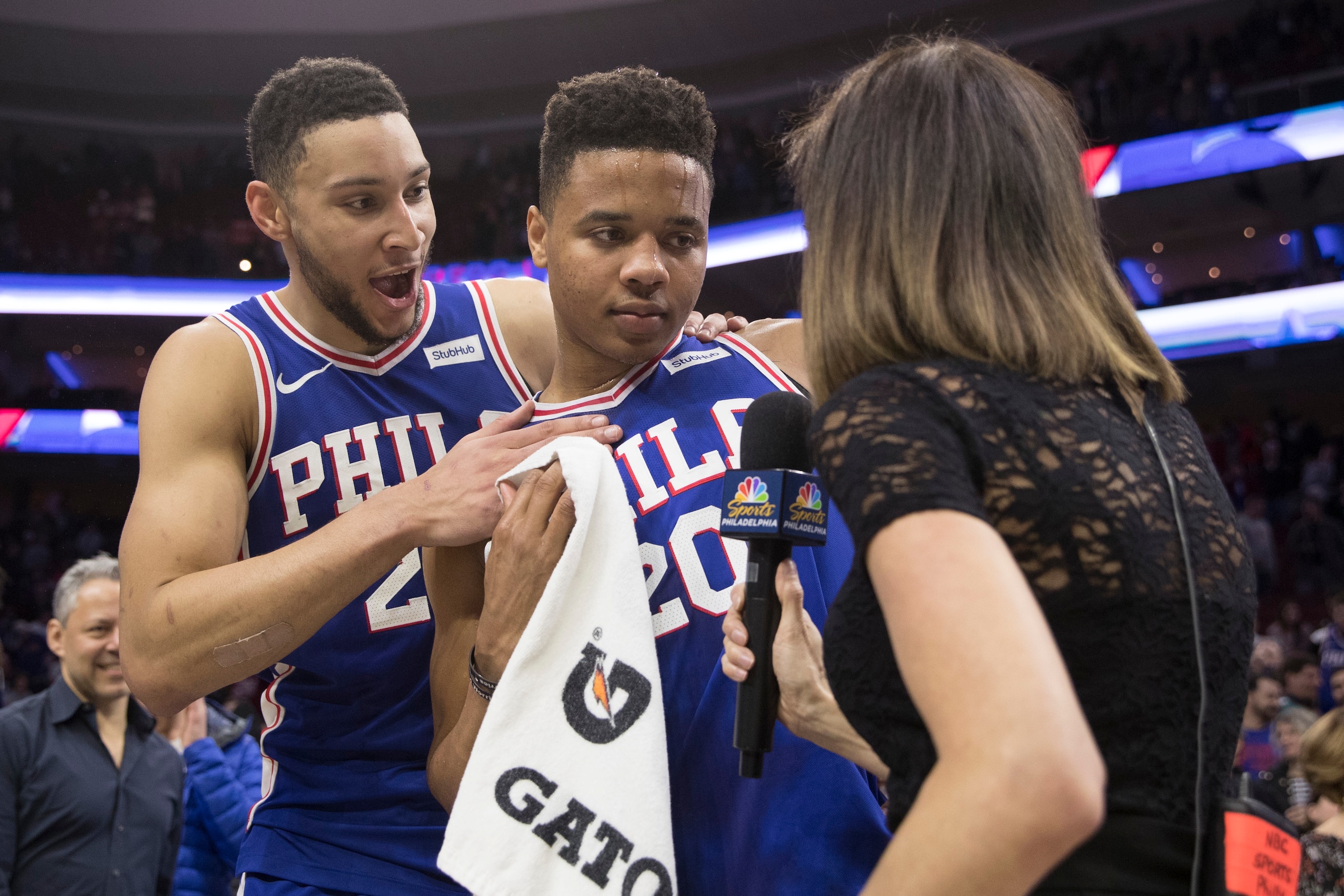 PHILADELPHIA, PA - MARCH 26: Ben Simmons #25 of the Philadelphia 76ers celebrates with Markelle Fultz #20 during his interview after the game against the Denver Nuggets at the Wells Fargo Center on March 26, 2018 in Philadelphia, Pennsylvania. The 76ers d